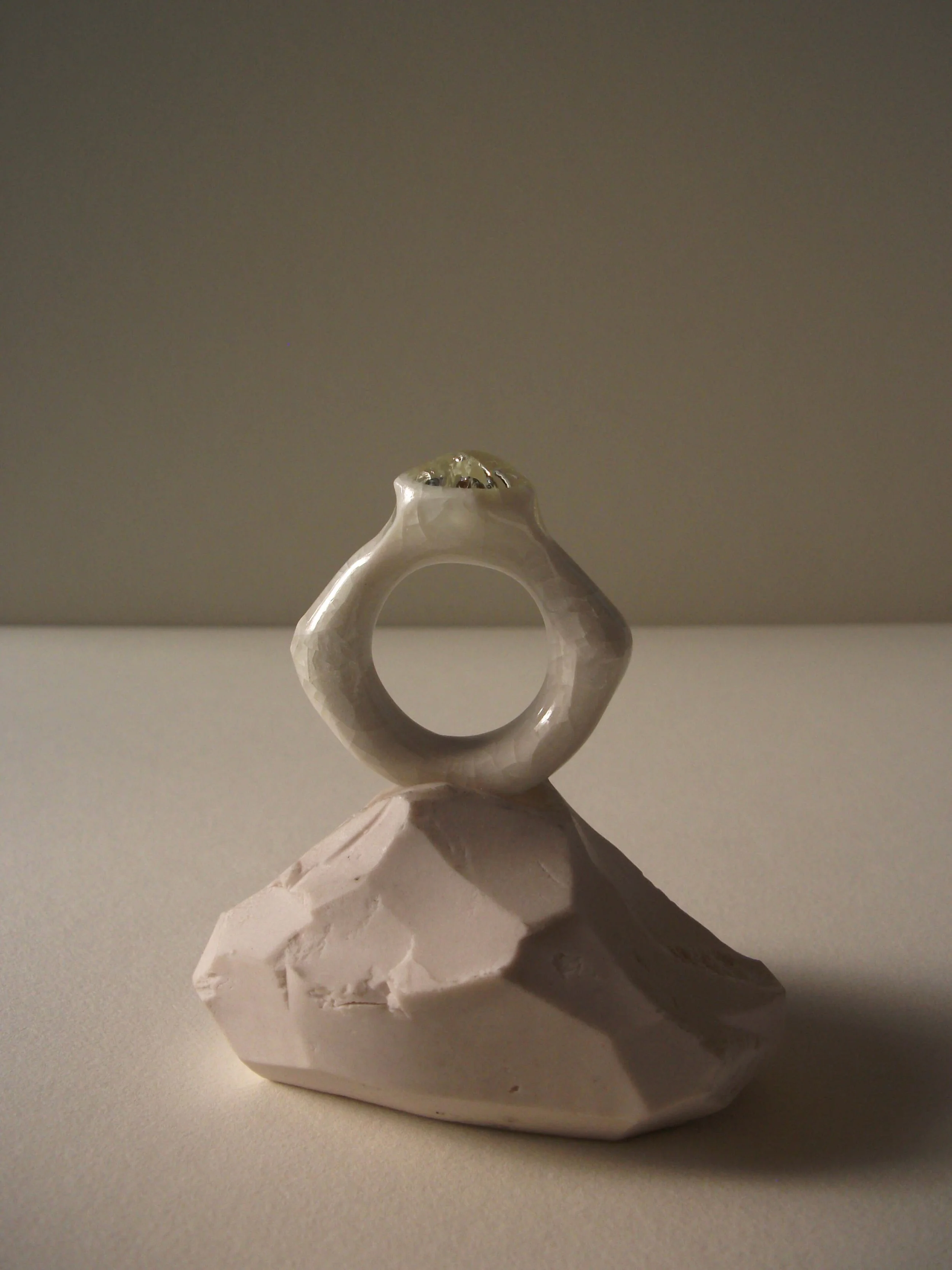 Bone-white porcelain ring with soft crackle surface and glass jewel