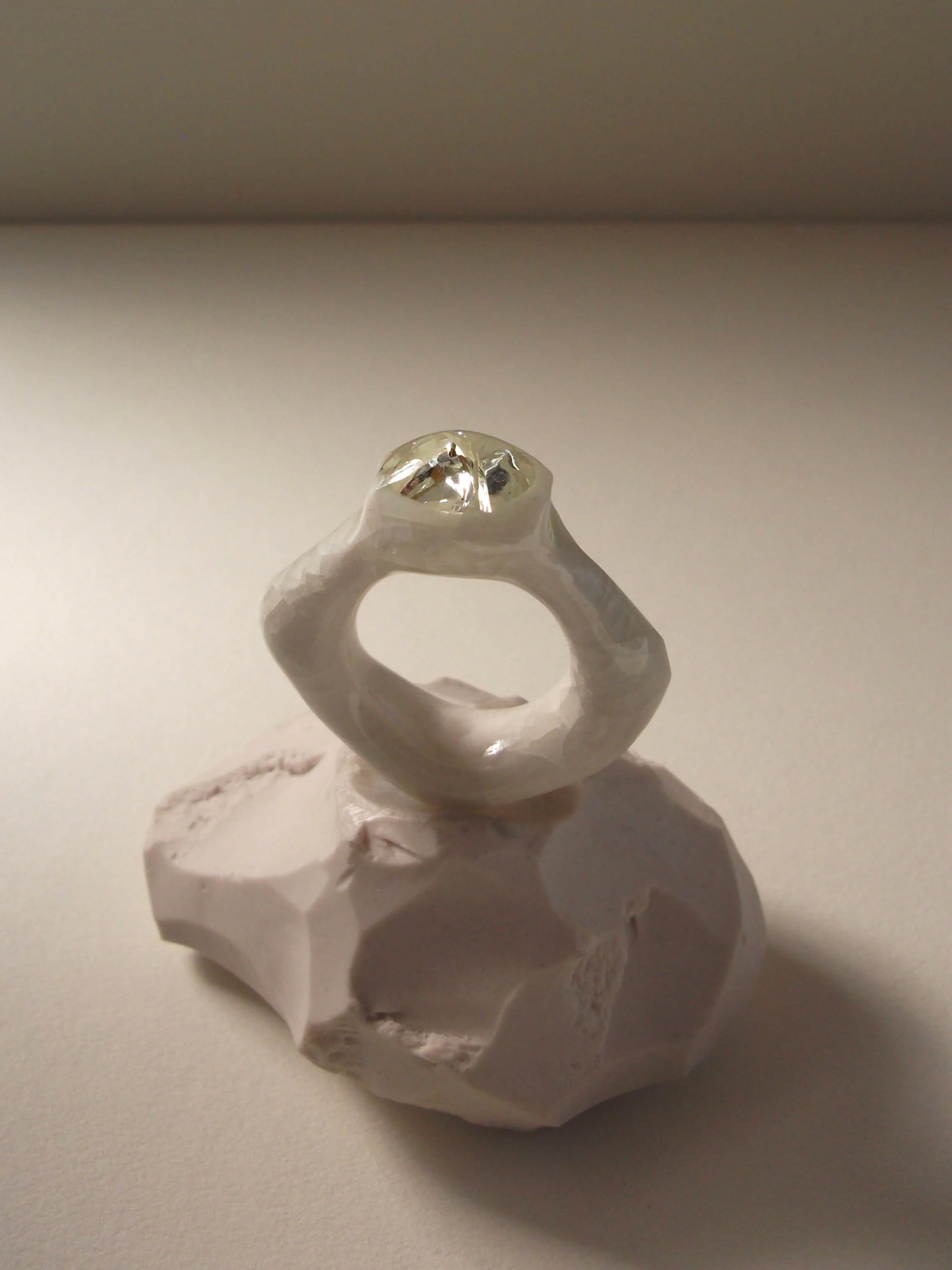 Bone-white porcelain ring with soft crackle surface and glass jewel