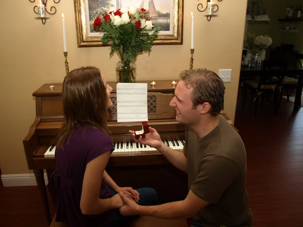 Chris proposing to Johnni beside the family piano