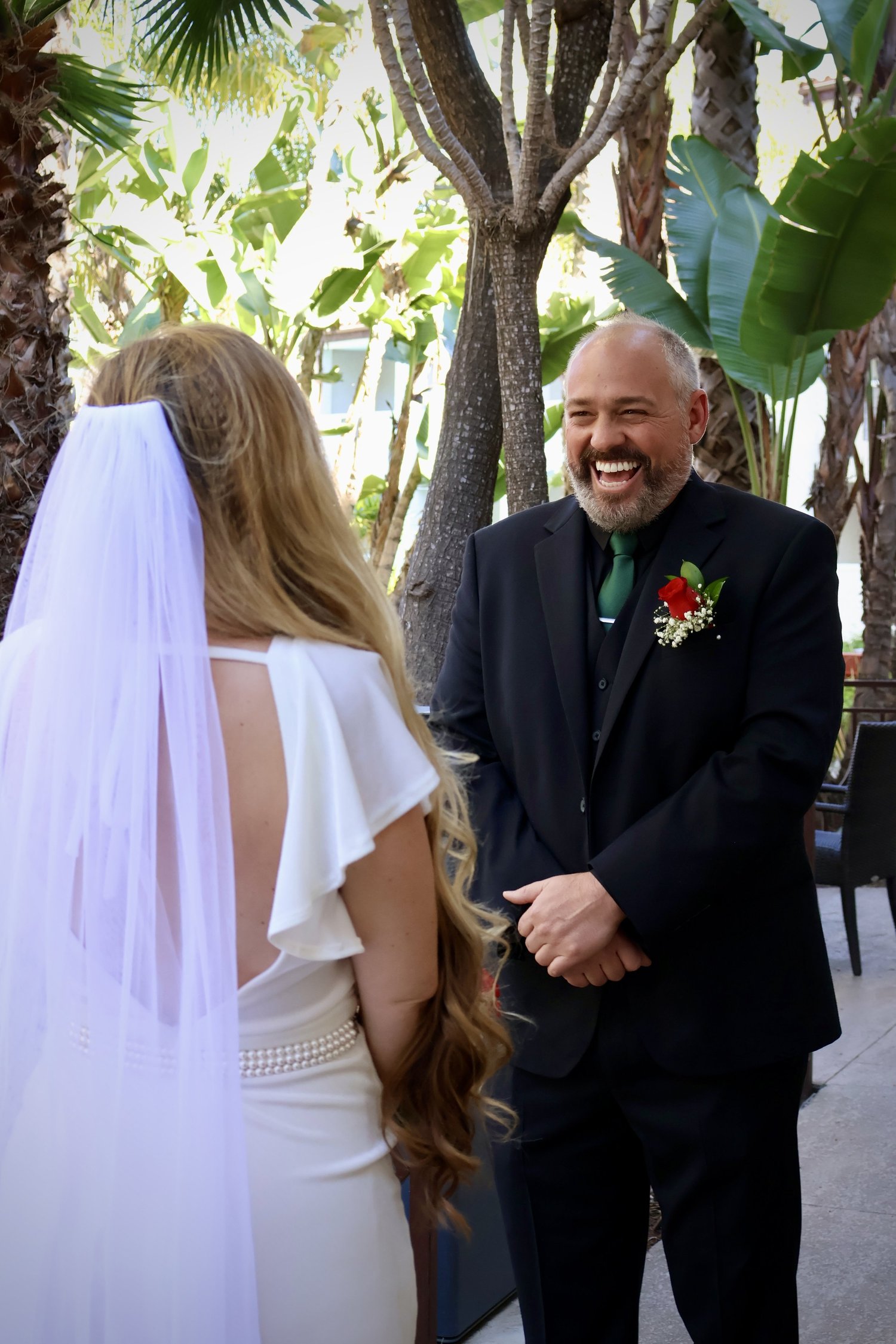 A joyful moment during an outdoor wedding ceremony