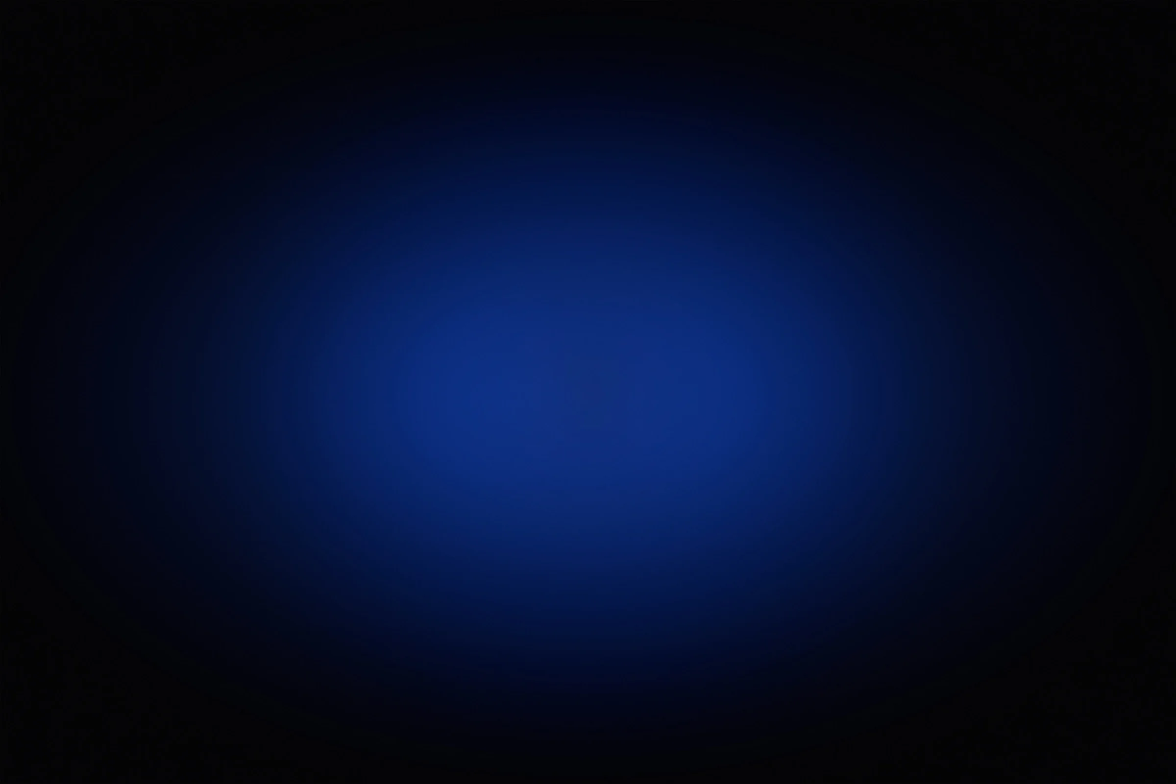 Blue glowing light in the center fading to darkness towards the edges.