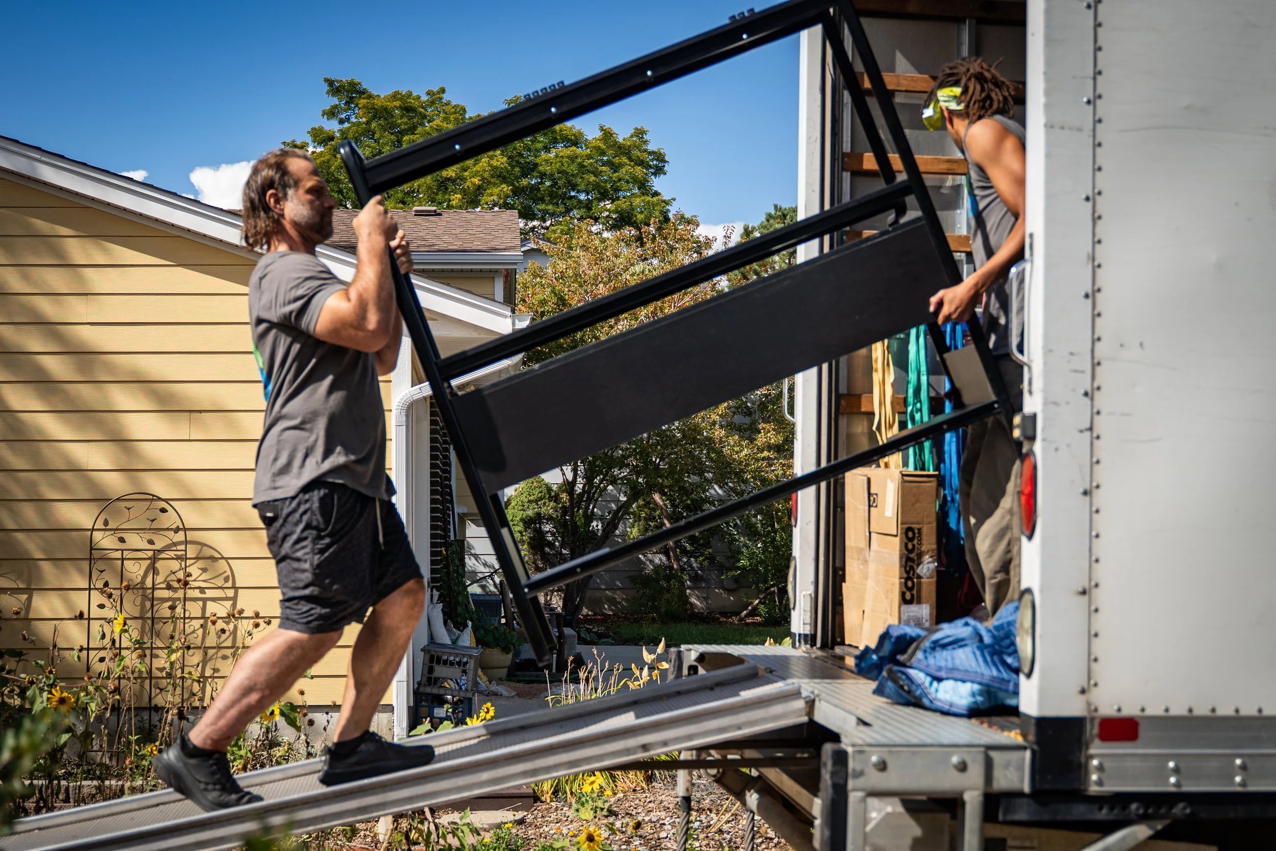 The Good Move movers loading furniture and boxes into the moving truck during a residential home move