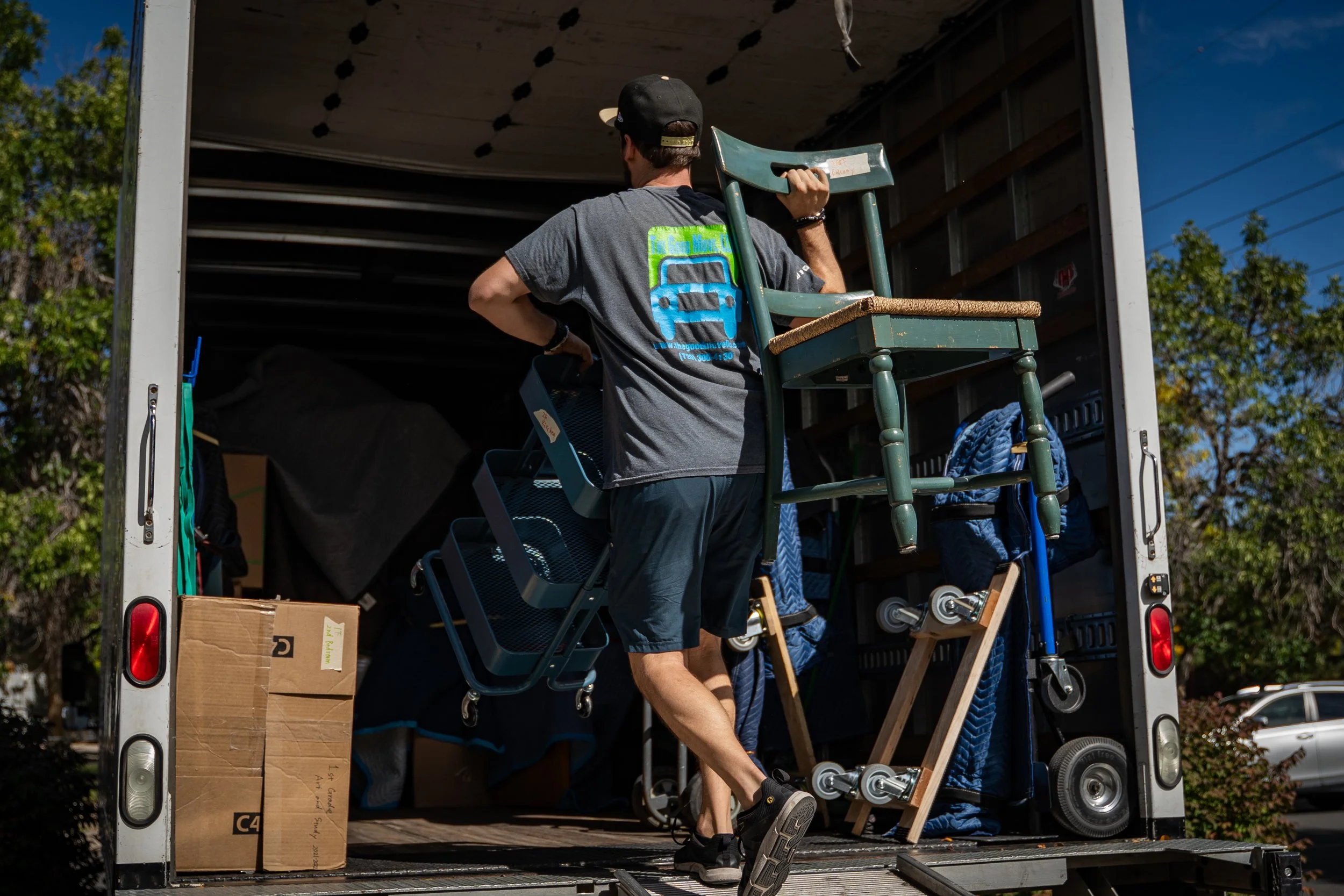 The Good Move mover unloading household items from the moving truck during a local Colorado move