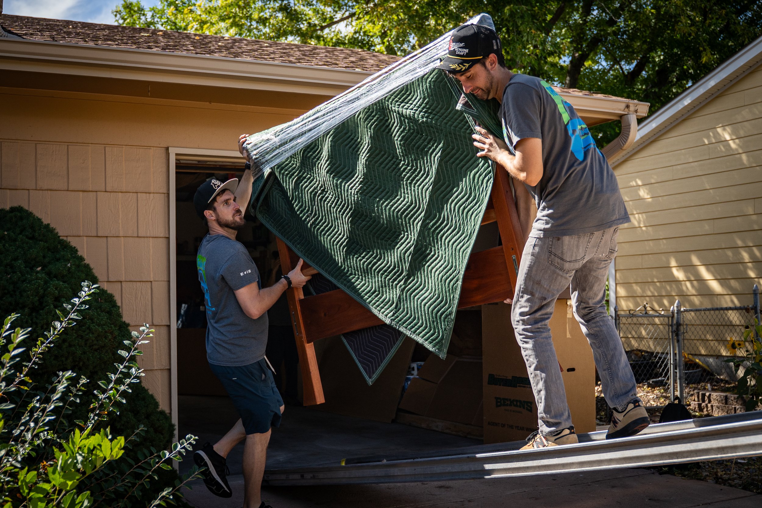 The Good Move movers transporting a large furniture item safely during a home move