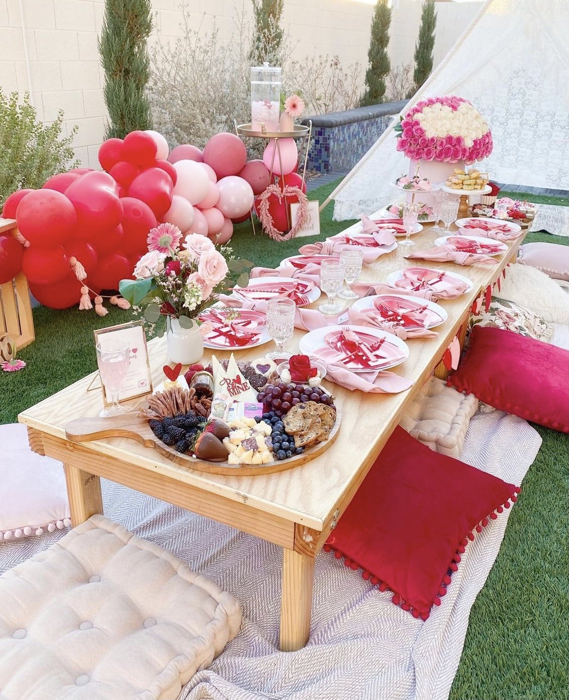 Valentine's Day picnic styling. Board, florals, and full scene setup.