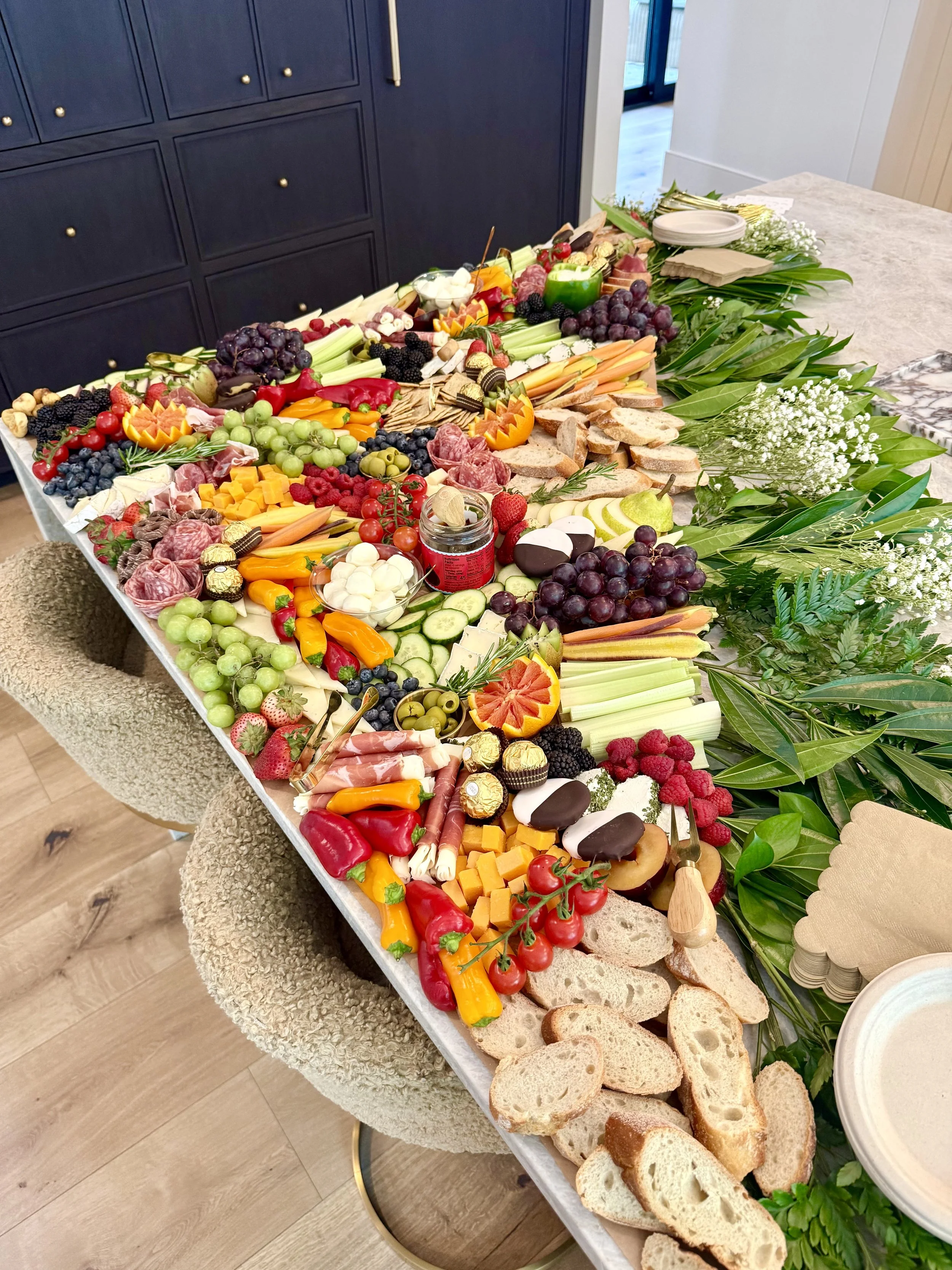 kitchen-island-grazing-navy-cabinets-crudite.jpeg