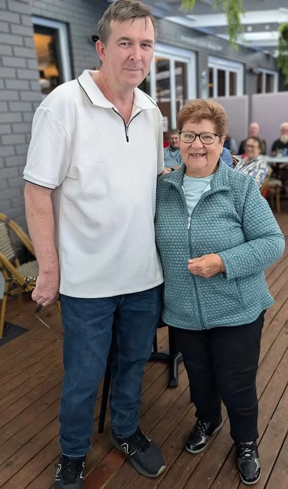 a man and woman smiling