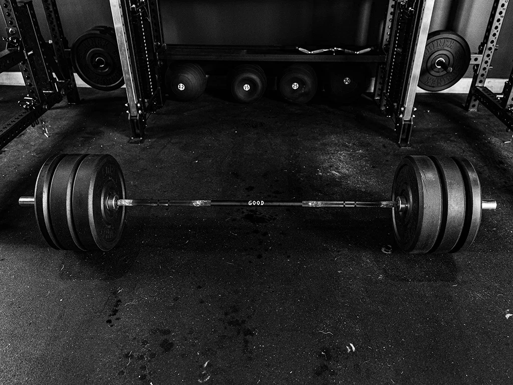 Sorinex weightlifting barbell loaded with bumper plates featured in The Terminal List intro garage