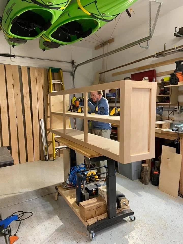 Brian cooper working on a woodworking project in a garage workshop