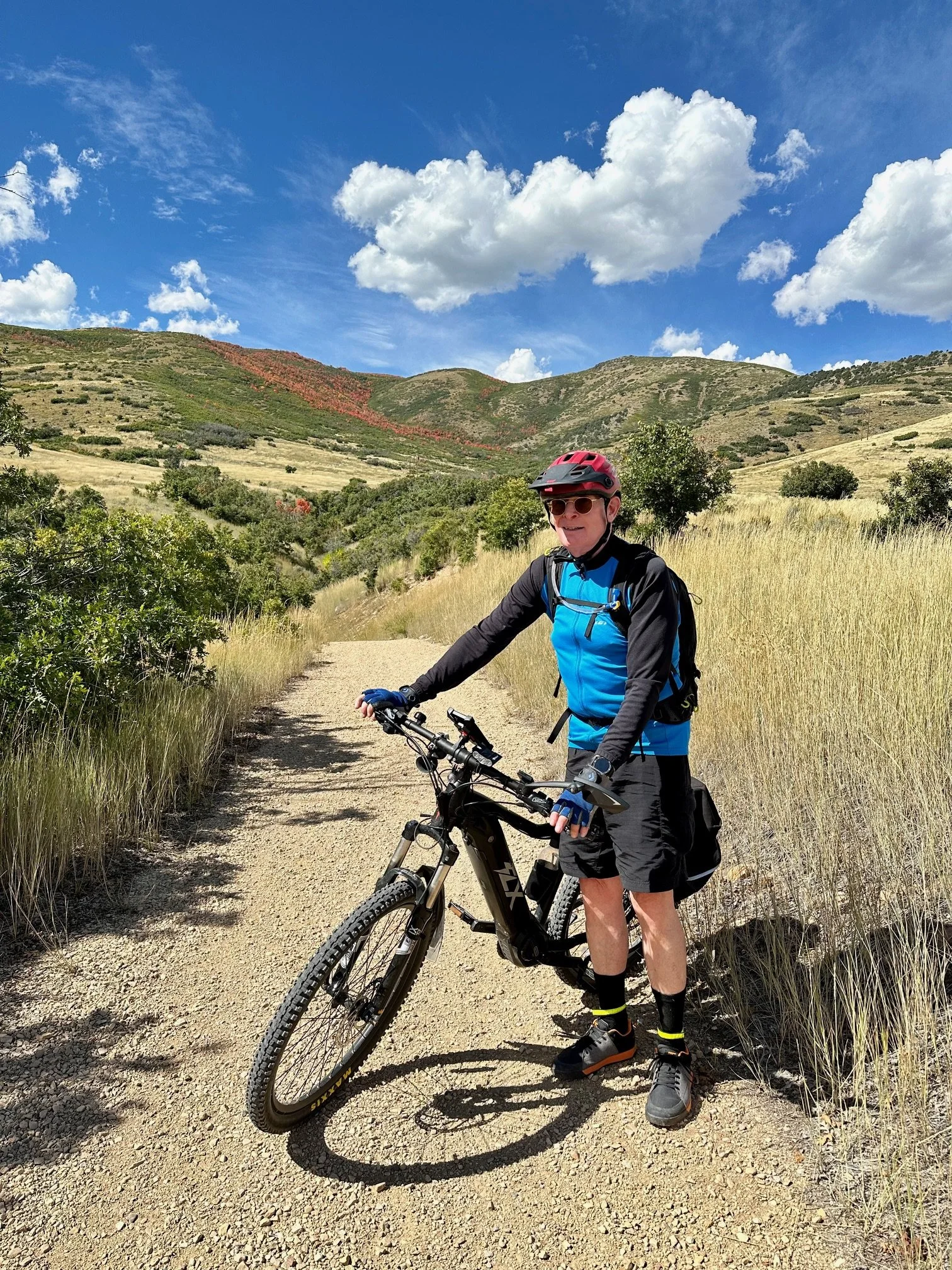 Brian Cooper biking along Perimeter Trail in Jordanelle Park