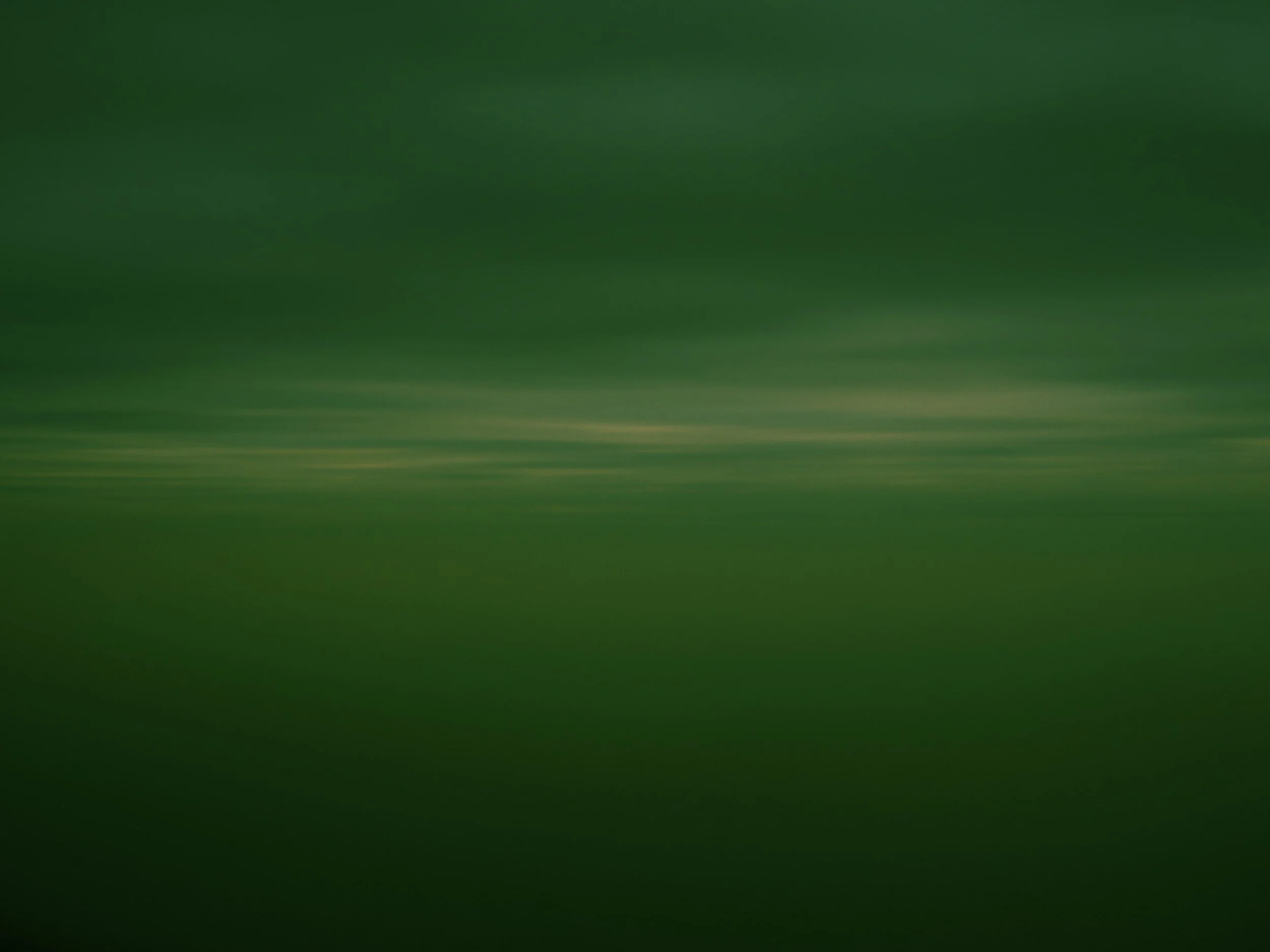 Landscape sky and water, green image.