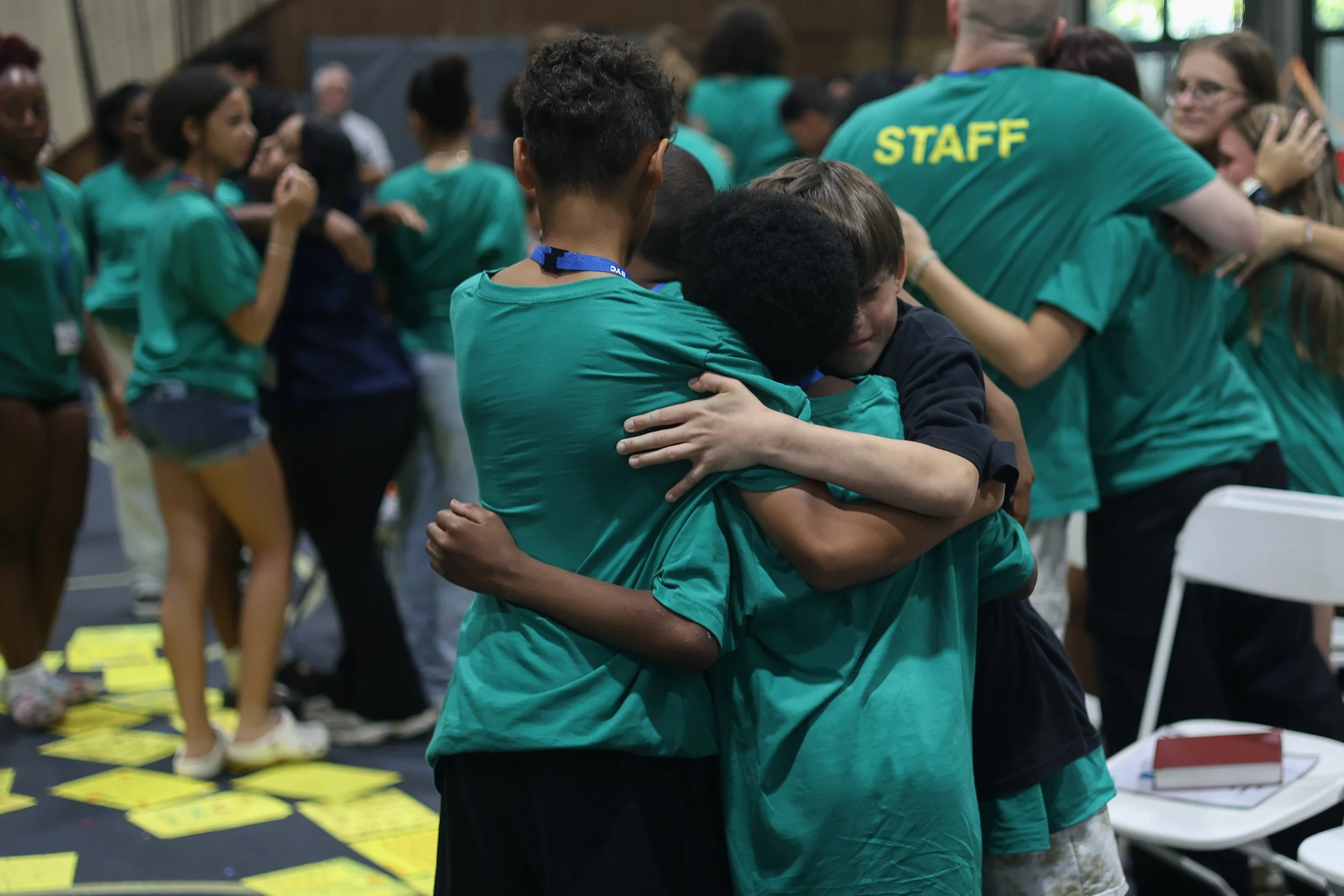 Children hugging at the end of a week at SYC.