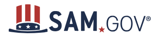 SAM.gov logo with large, dark blue letters on a white background. Displays a top hat to the left with a U.S. flag pattern.