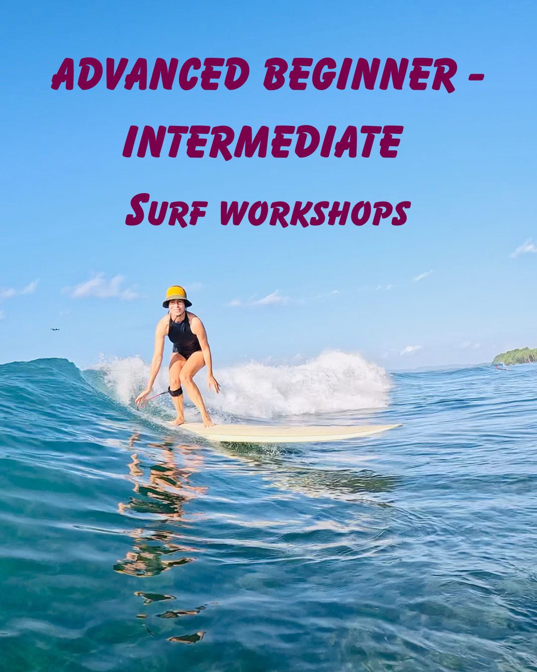 A woman surfing on a wave in the ocean with a clear blue sky overhead, wearing a yellow hat and black swimsuit, with text overlay that reads 'Advanced Beginner - Intermediate Surf Workshops'.