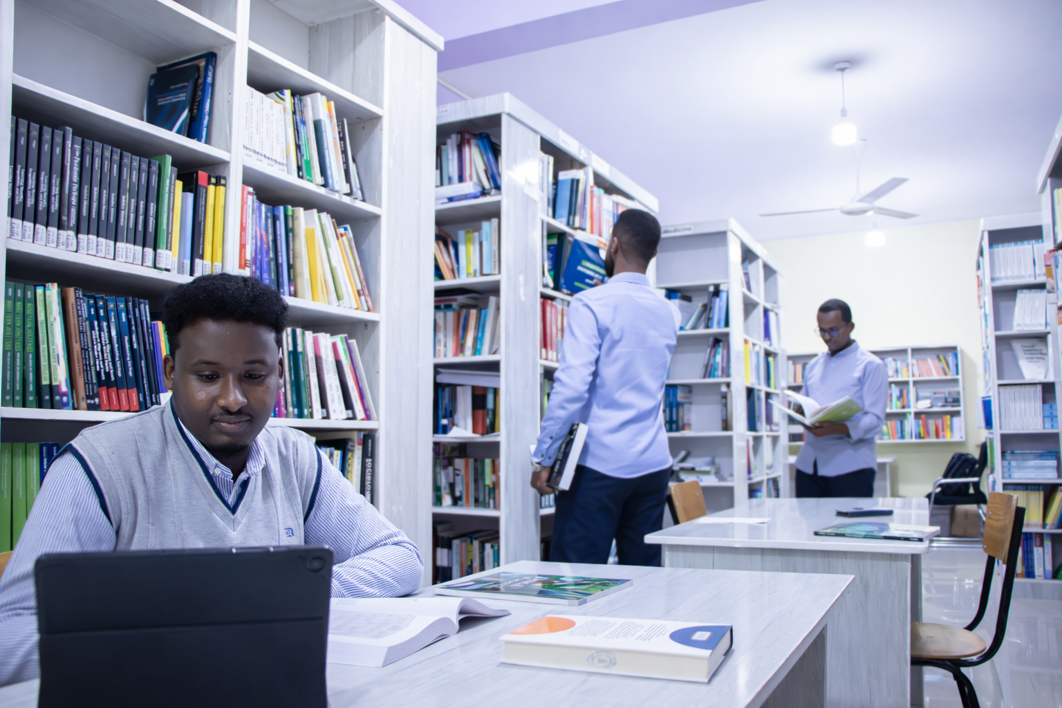 students in library male.png