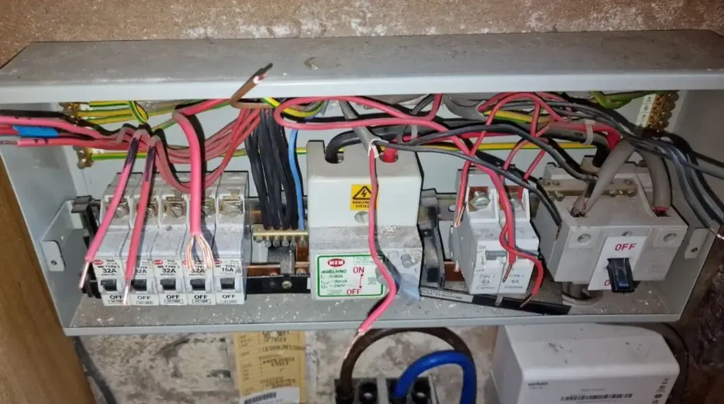 old MEM consumer unit, cable disconnected for replacement, Liverpool