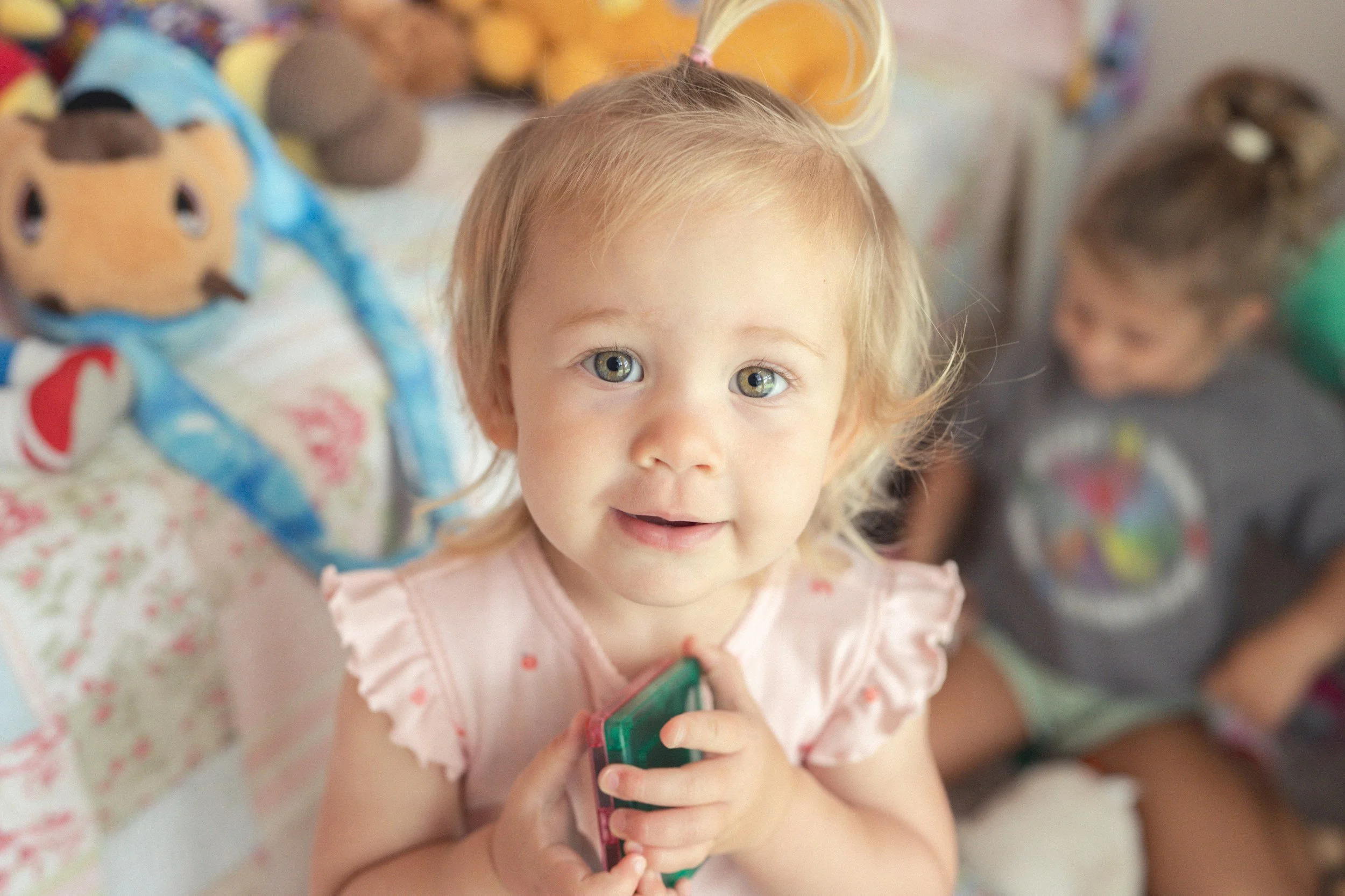 Smiling toddler girl looking at the camera