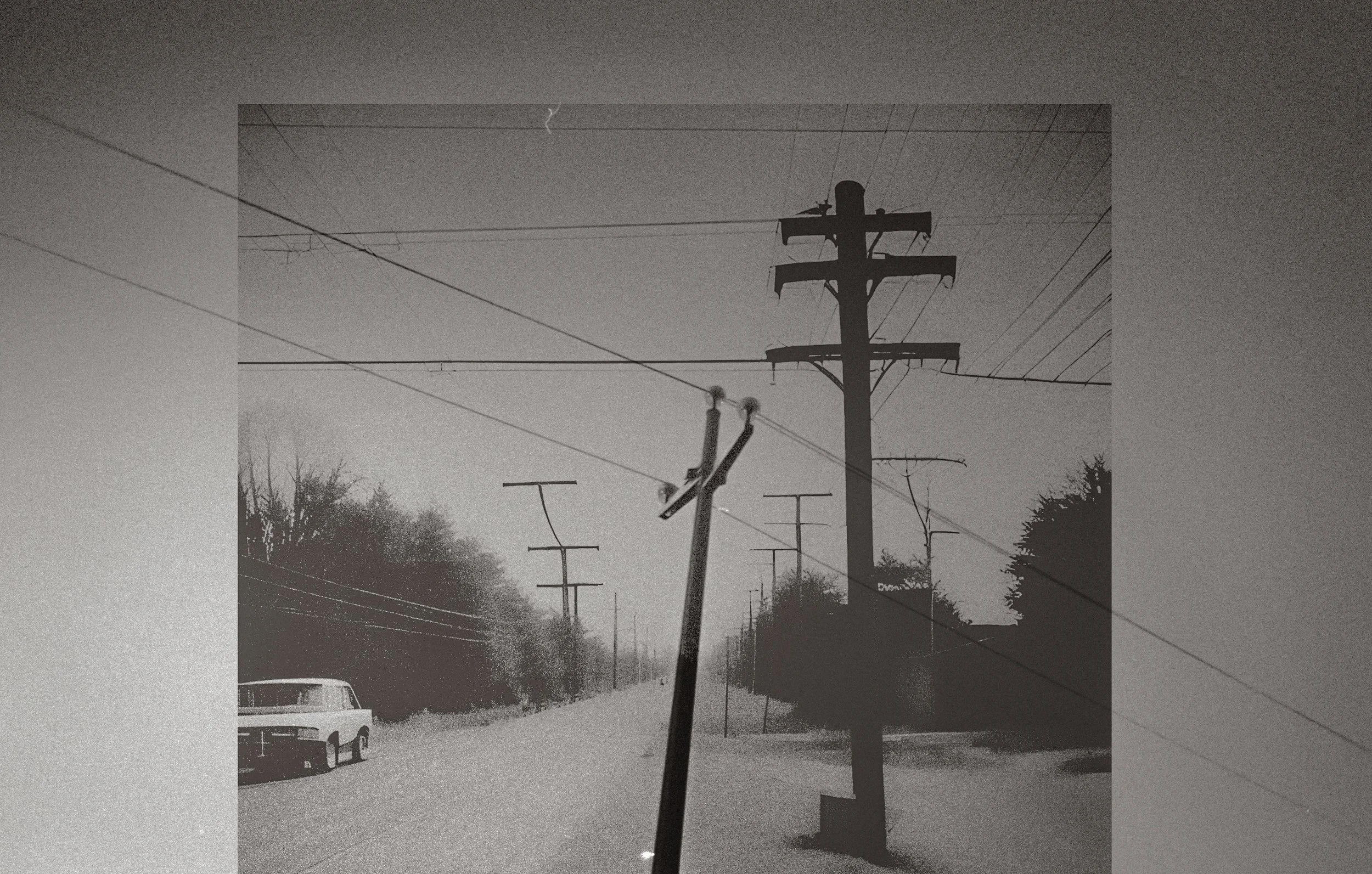 a telephone pole with power lines in the background.jpg