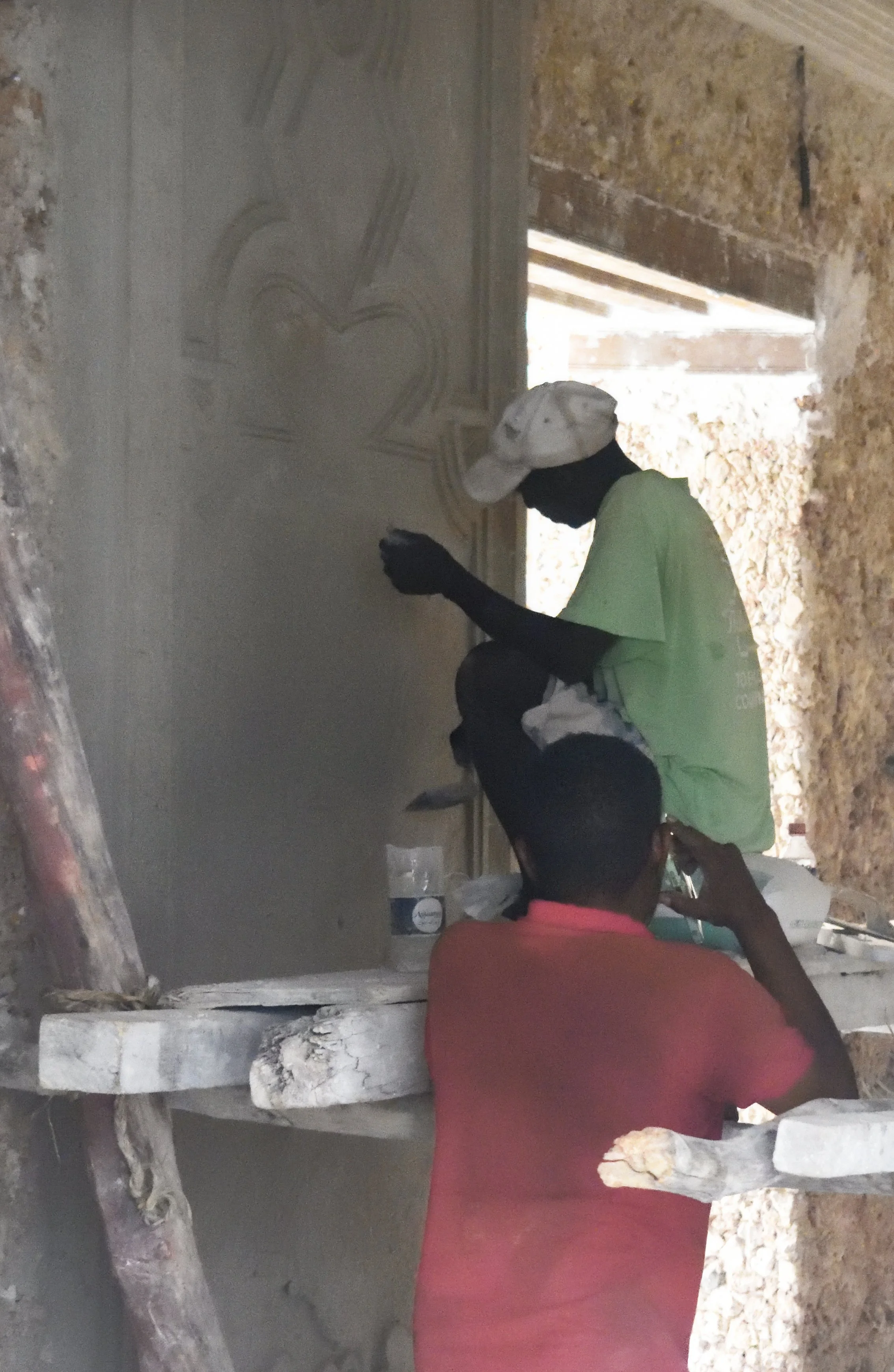 Men doing construction on wall