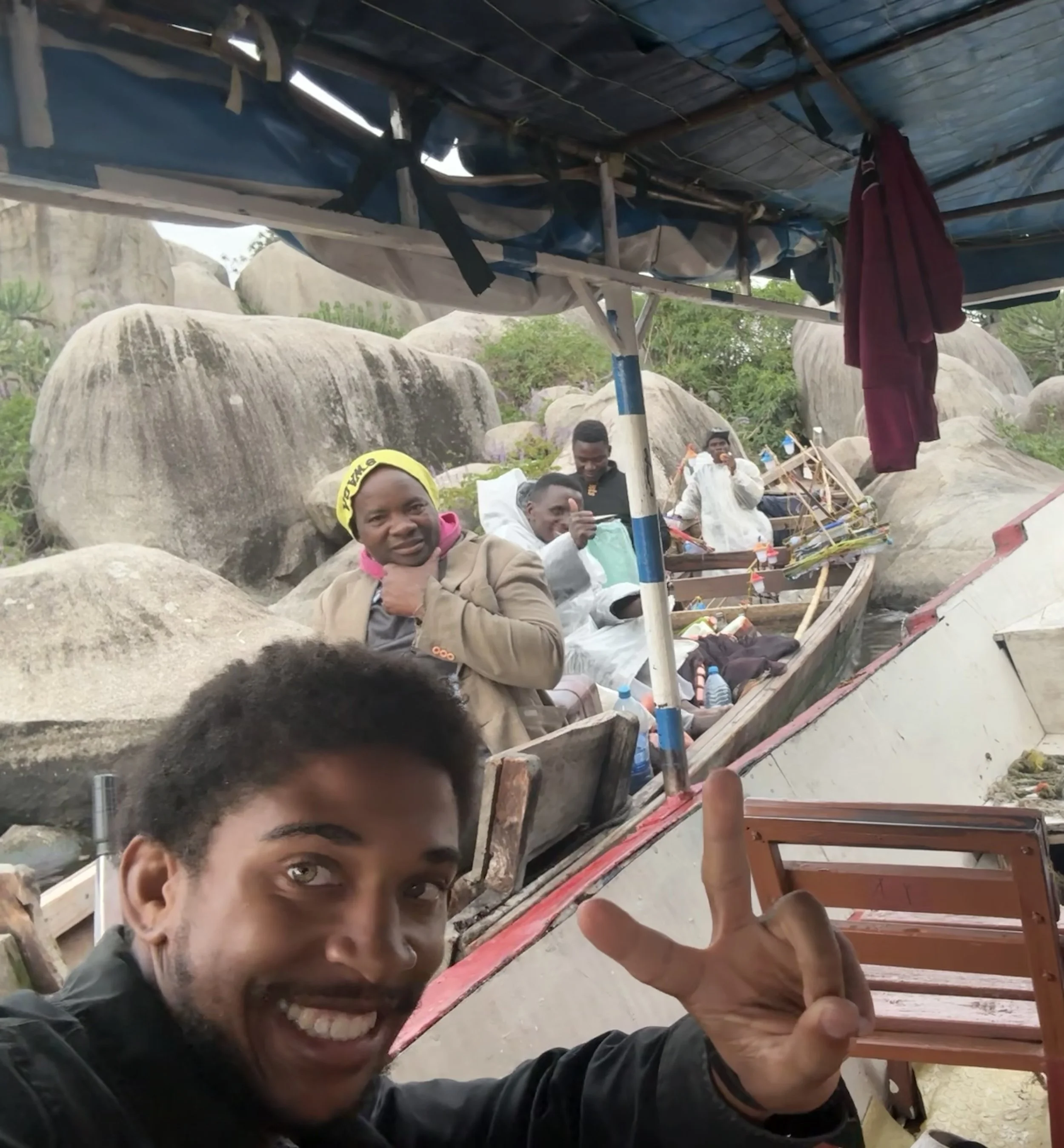 Joshua and Local fisherman on their boat