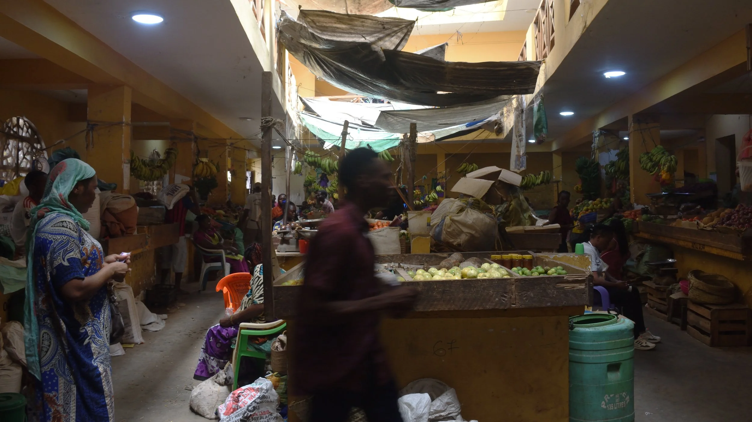 man walking in vegetable market