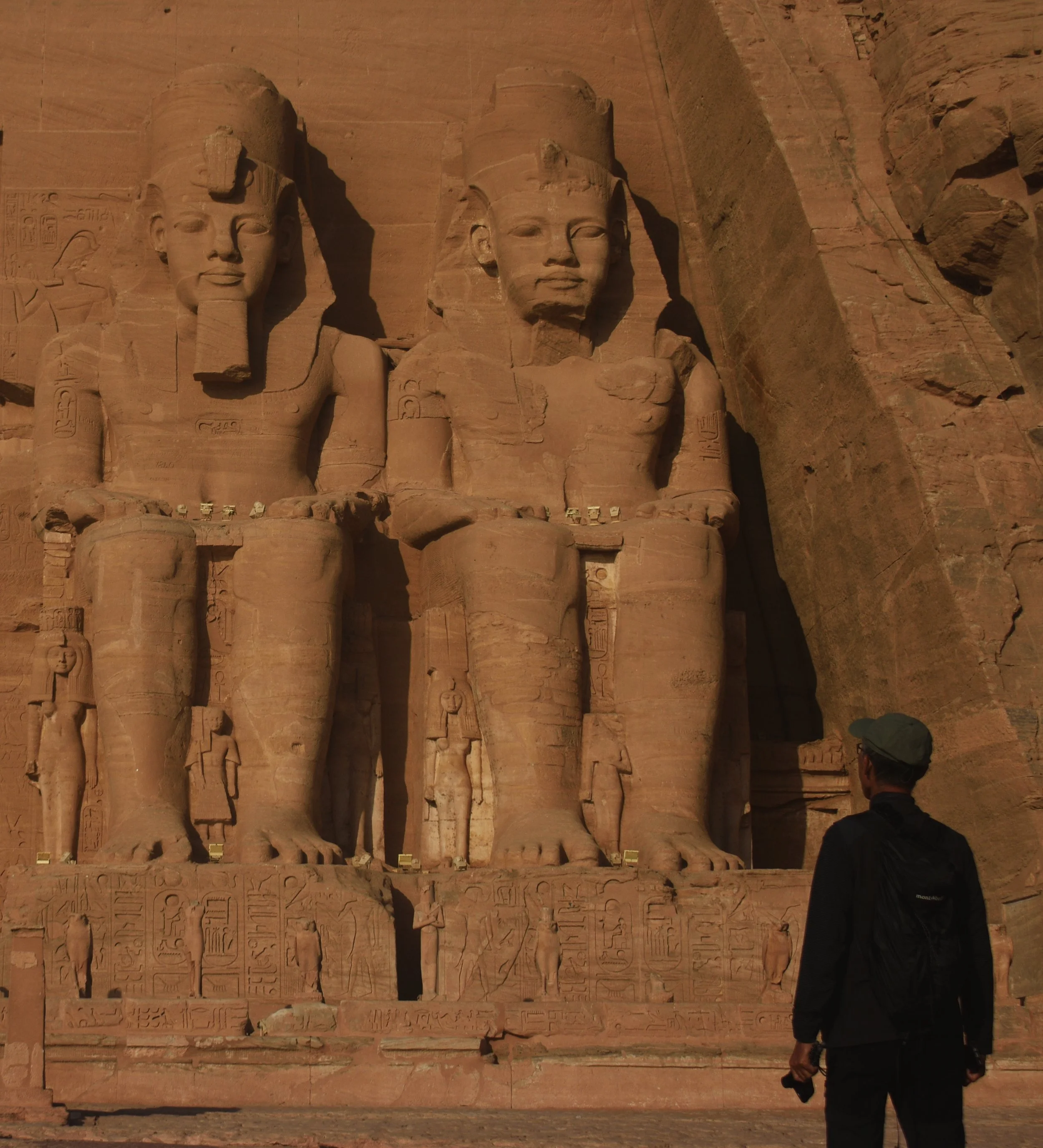 Man looking at Egyptian Statues