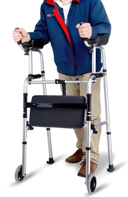 Chiropractor adjusting a woman's neck during a consultation. The woman is lying face down on a chiropractic table, wearing purple leggings and a black sports bra. The chiropractor is bald, muscular, and wearing a black Under Armour polo shirt with a logo on the chest.
