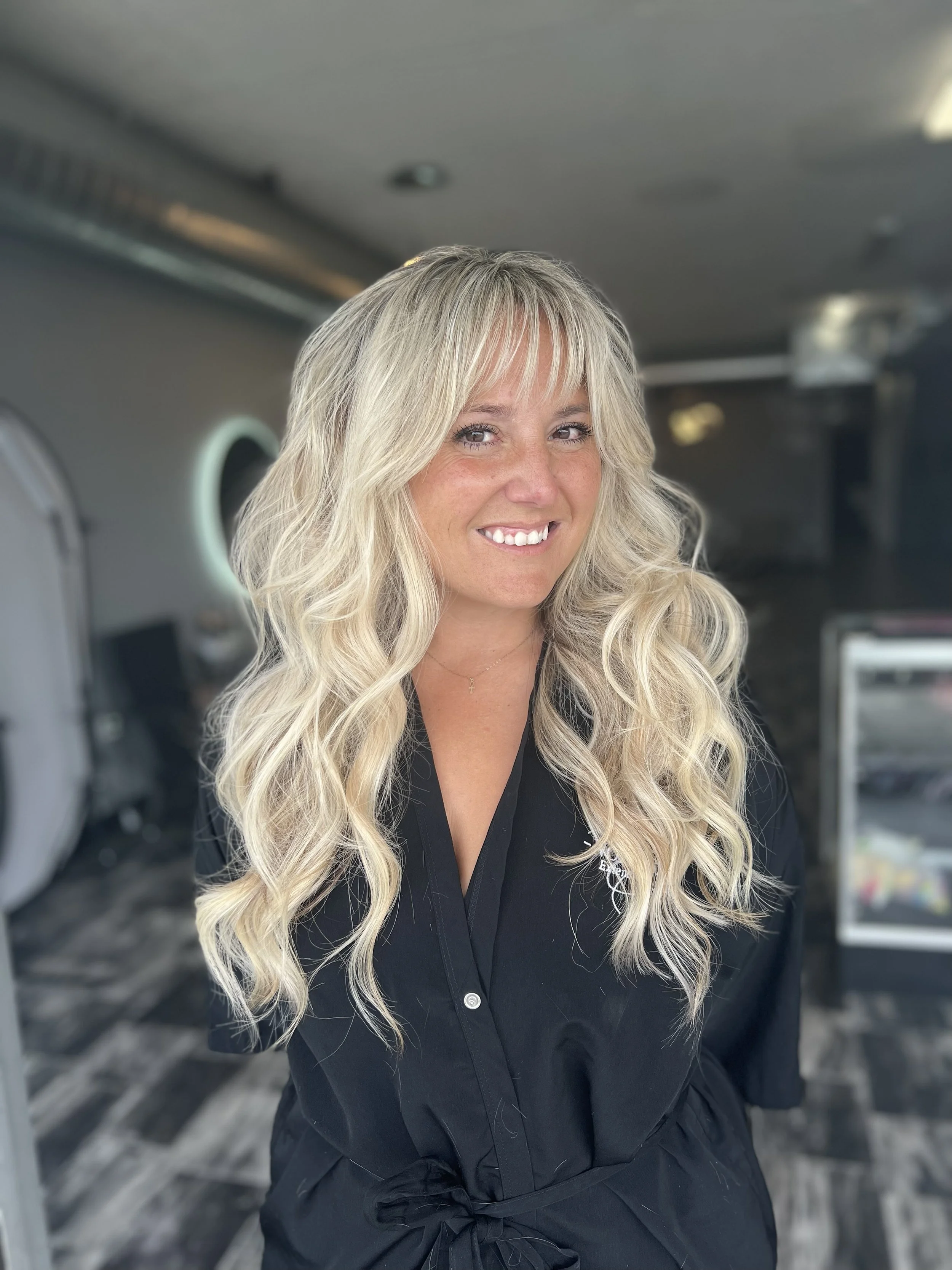 E. Noir Extensions guest, blonde hair, wearing two rows of extensions.