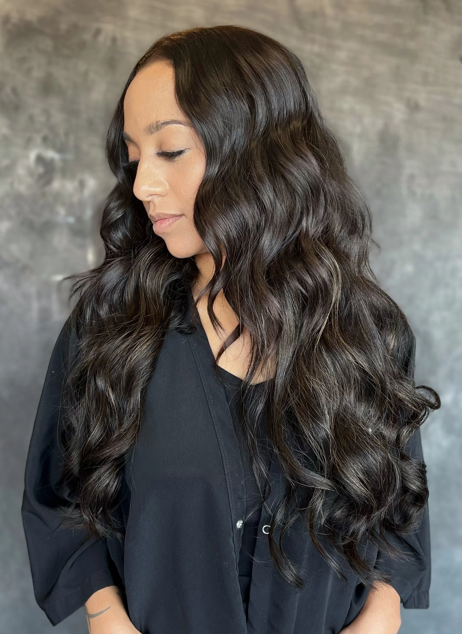 E. Noir Extensions guest, brunette wearing two rows of extensions