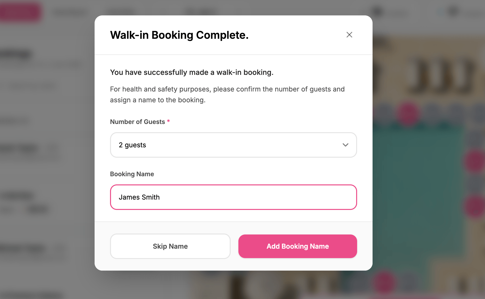 Confirmation message on a website indicating that a walk-in booking has been successfully completed for two guests, with options to add a booking name or skip.