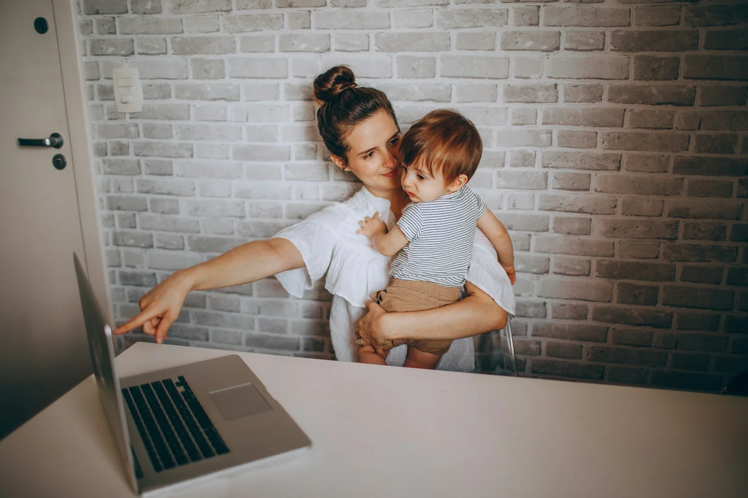 Mom balancing work and caring for her child