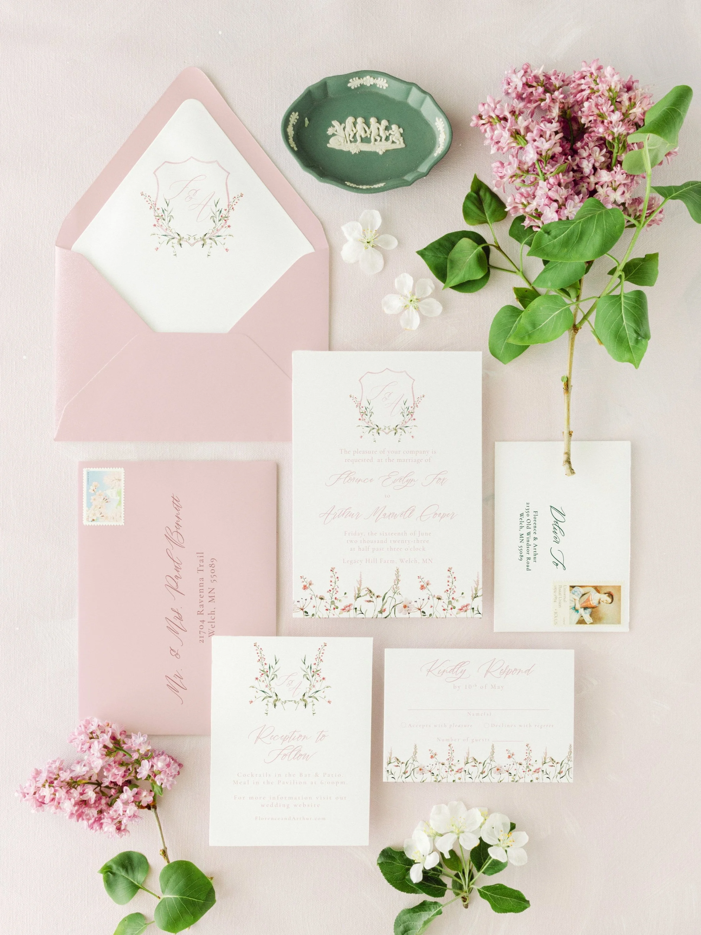 The Florence Collection wedding suite featuring blush pink watercolor florals, a floral crest monogram, and classic serif typography. A refined invitation set inspired by the gardens of Provence.