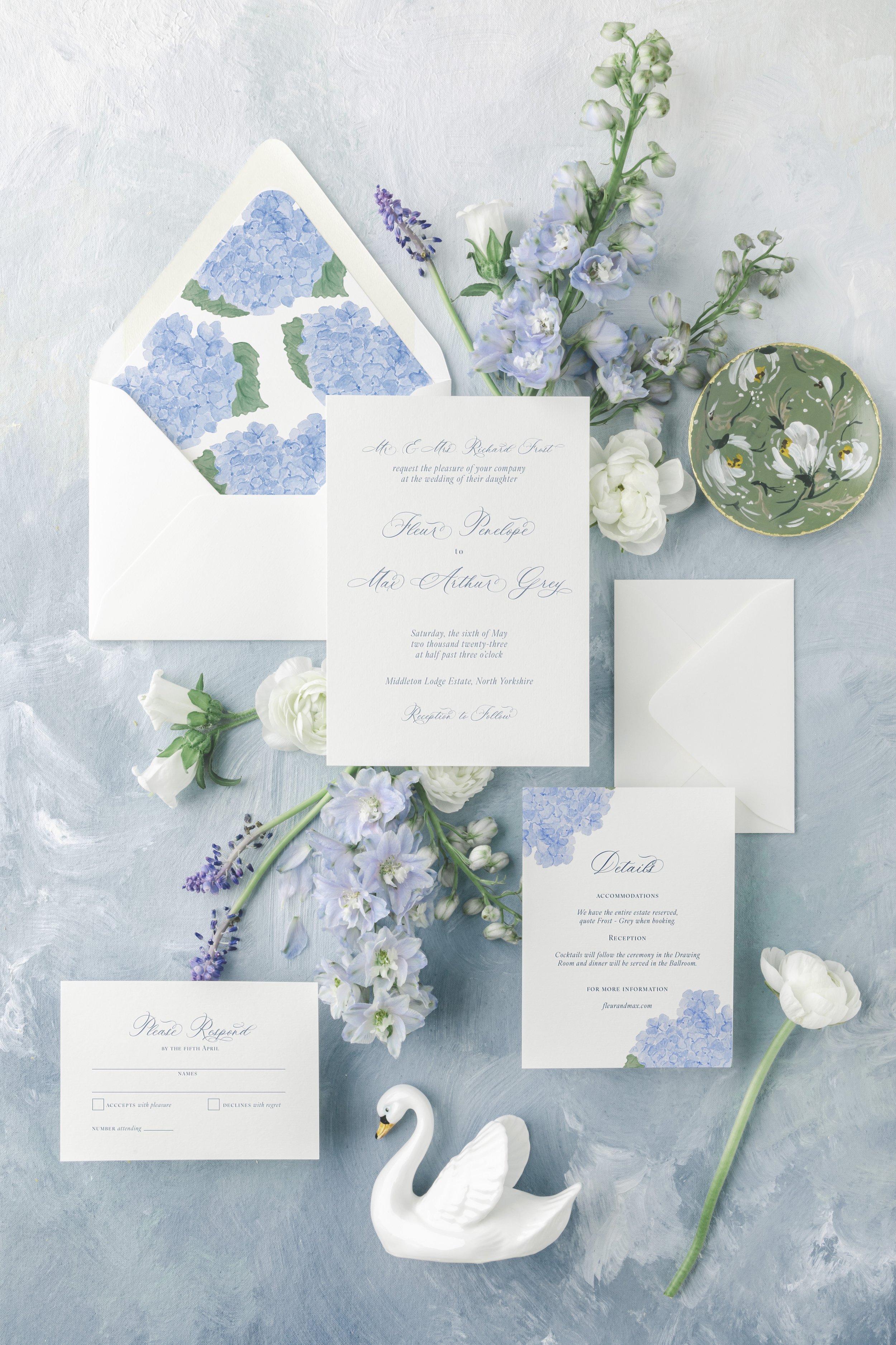 Fleur wedding invitation suite with pale blue watercolor florals inspired by English garden design.