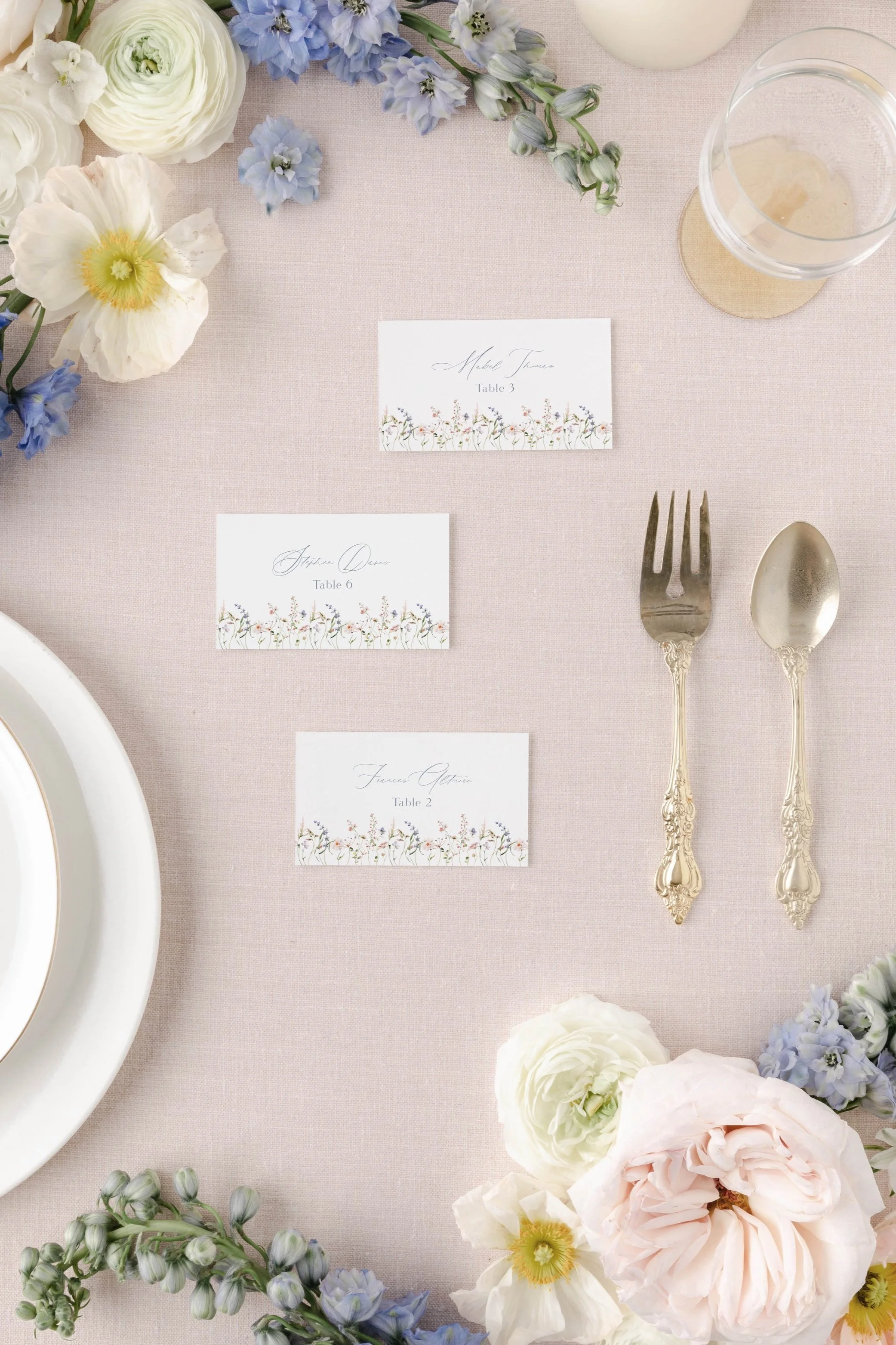 Petal place cards featuring soft watercolor florals designed to coordinate with the invitation suite.
