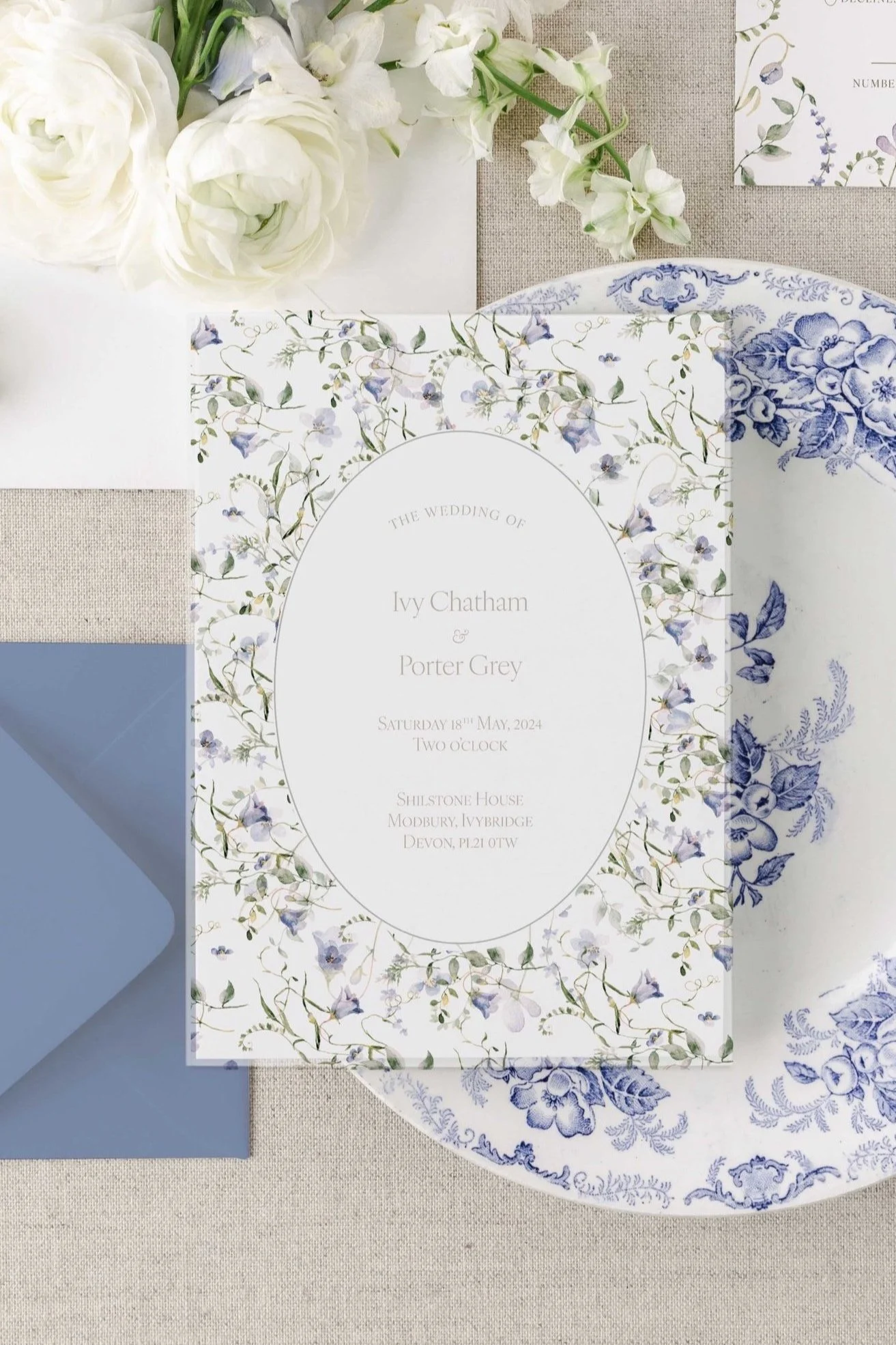 Ivy wedding invitation with a translucent vellum overlay and botanical detailing.