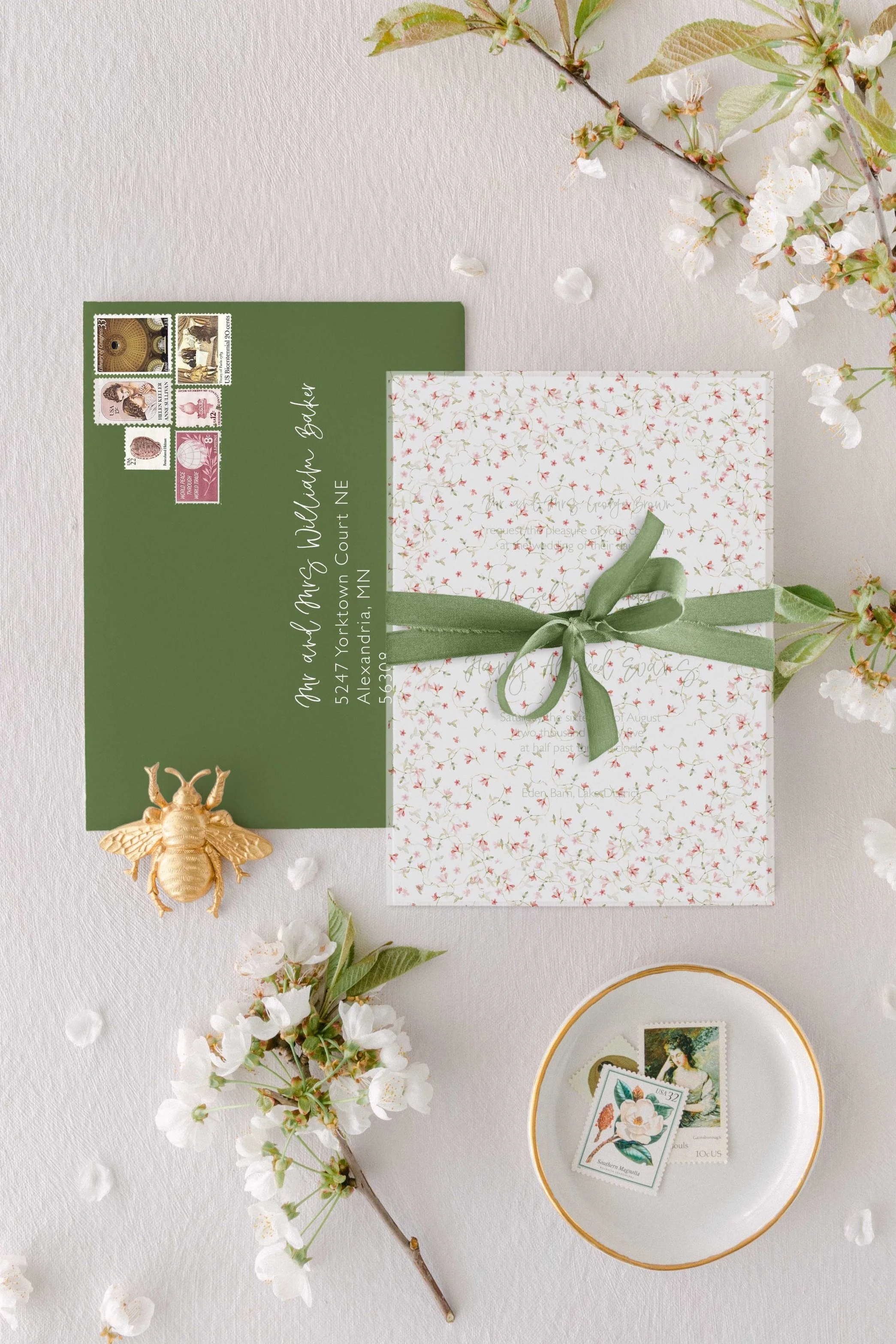 Roselyn wedding invitation suite layered with a vellum overlay and tied with a soft silk ribbon.