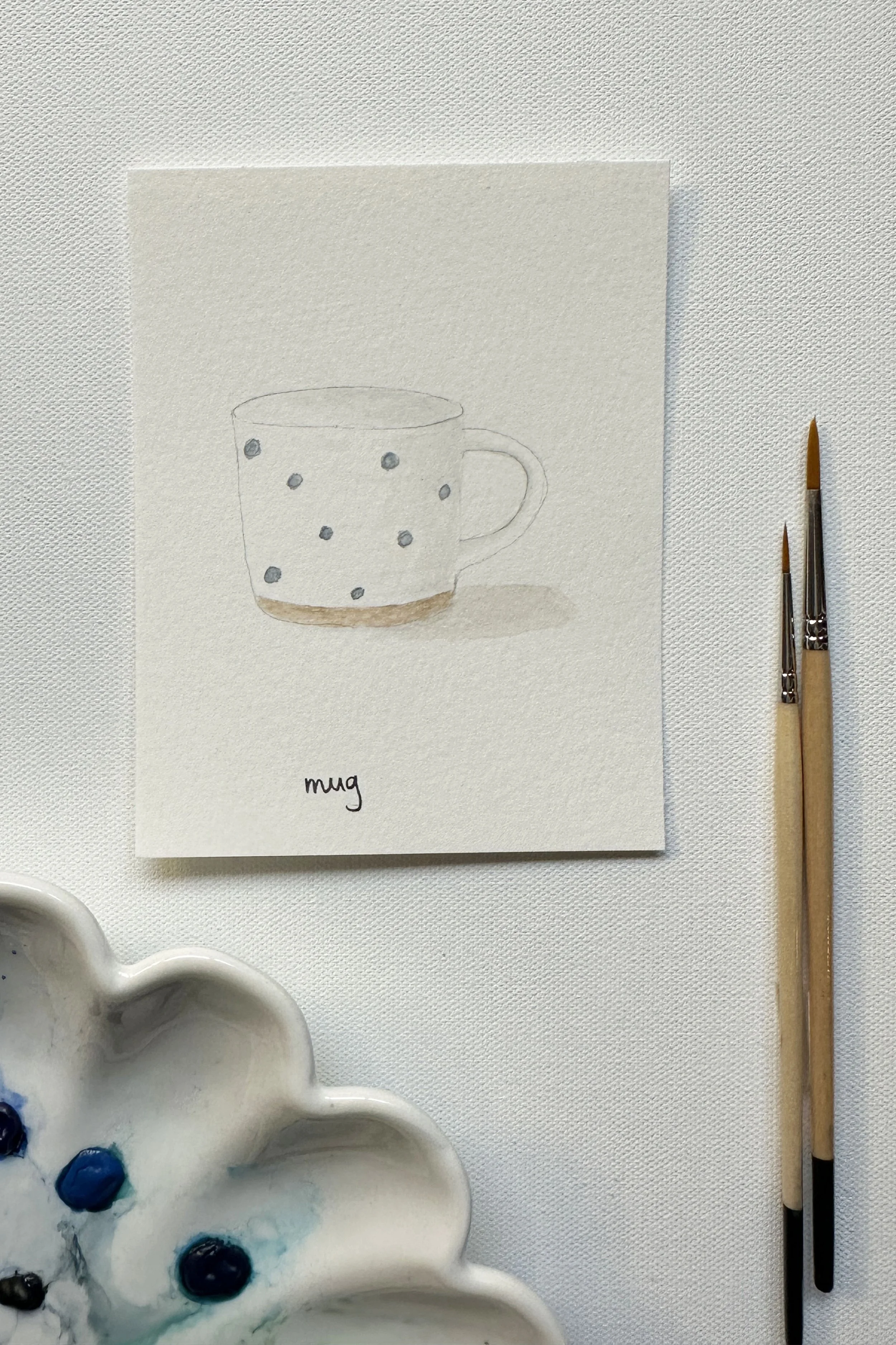 A watercolor blue polka dot mug, painted for the September cozy mugs theme.
