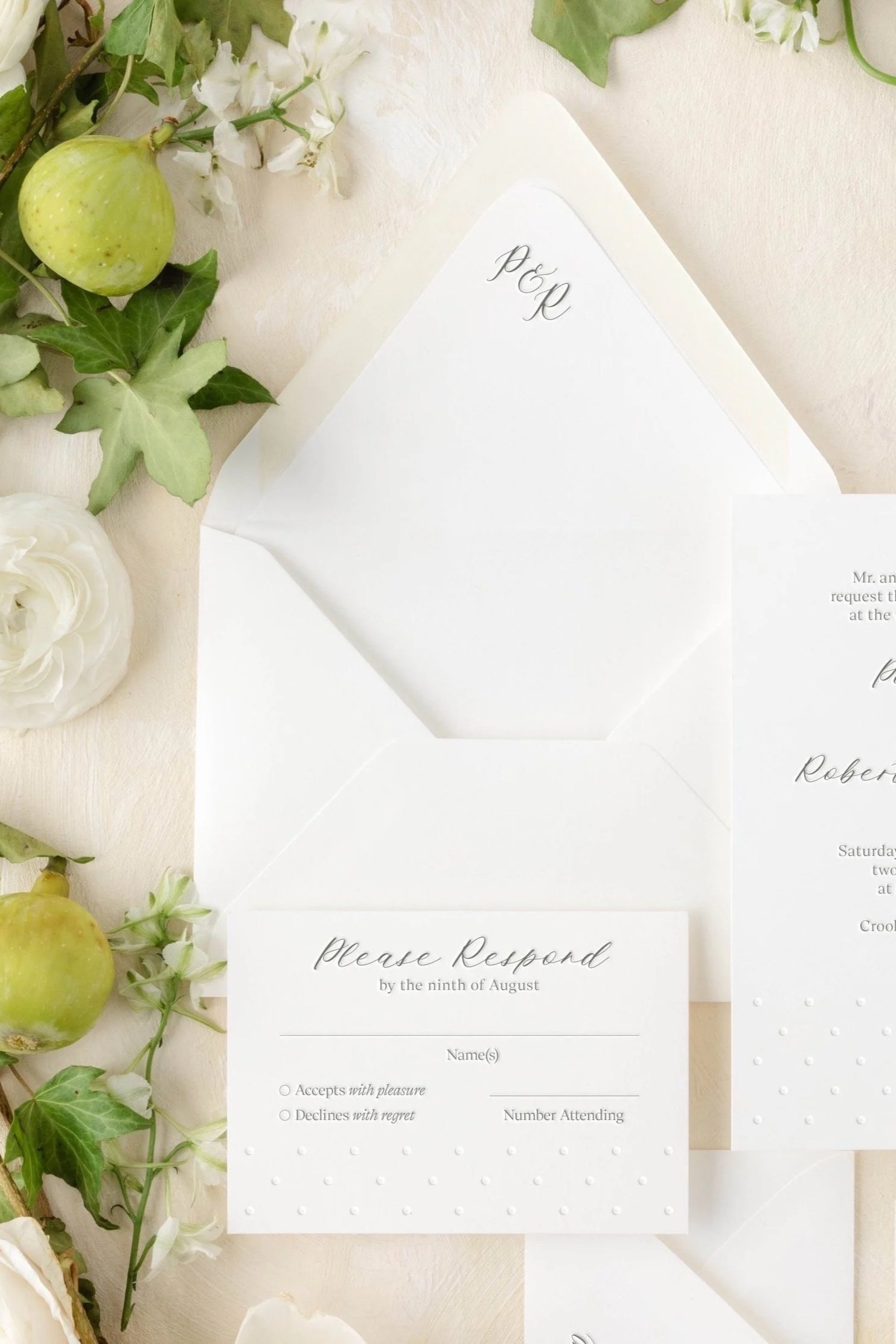 Poppy RSVP card with subtle Swiss dot texture, printed on soft cotton paper.