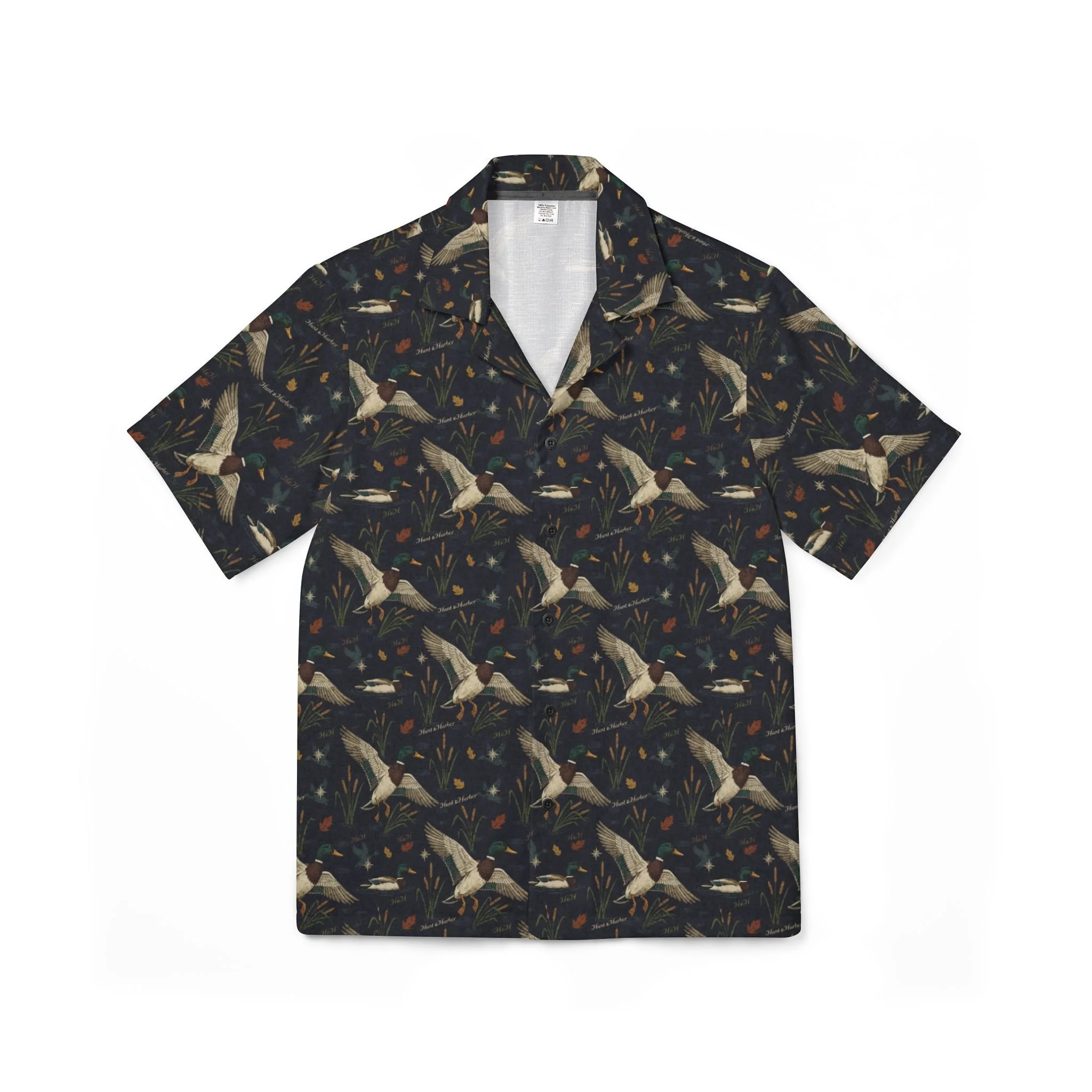 Hunt & Harbor Mallard Season Camp Collar Shirt in dark navy with allover flying mallard duck, cattail, and marsh botanical print. Short sleeve button-up camp collar shirt.
