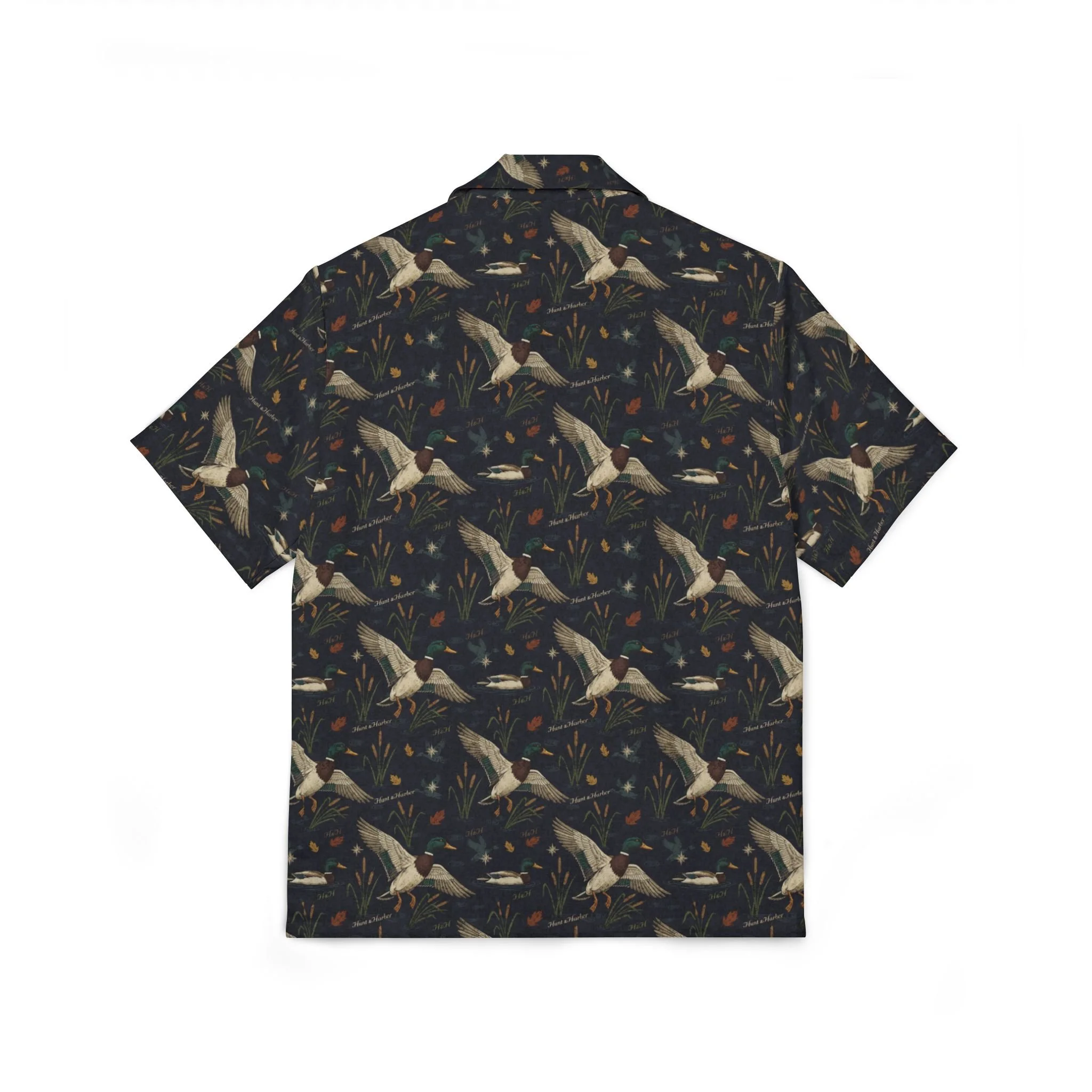 Hunt & Harbor Mallard Season Camp Collar Shirt in dark navy with allover flying mallard duck, cattail, and marsh botanical print. Short sleeve button-up camp collar shirt.