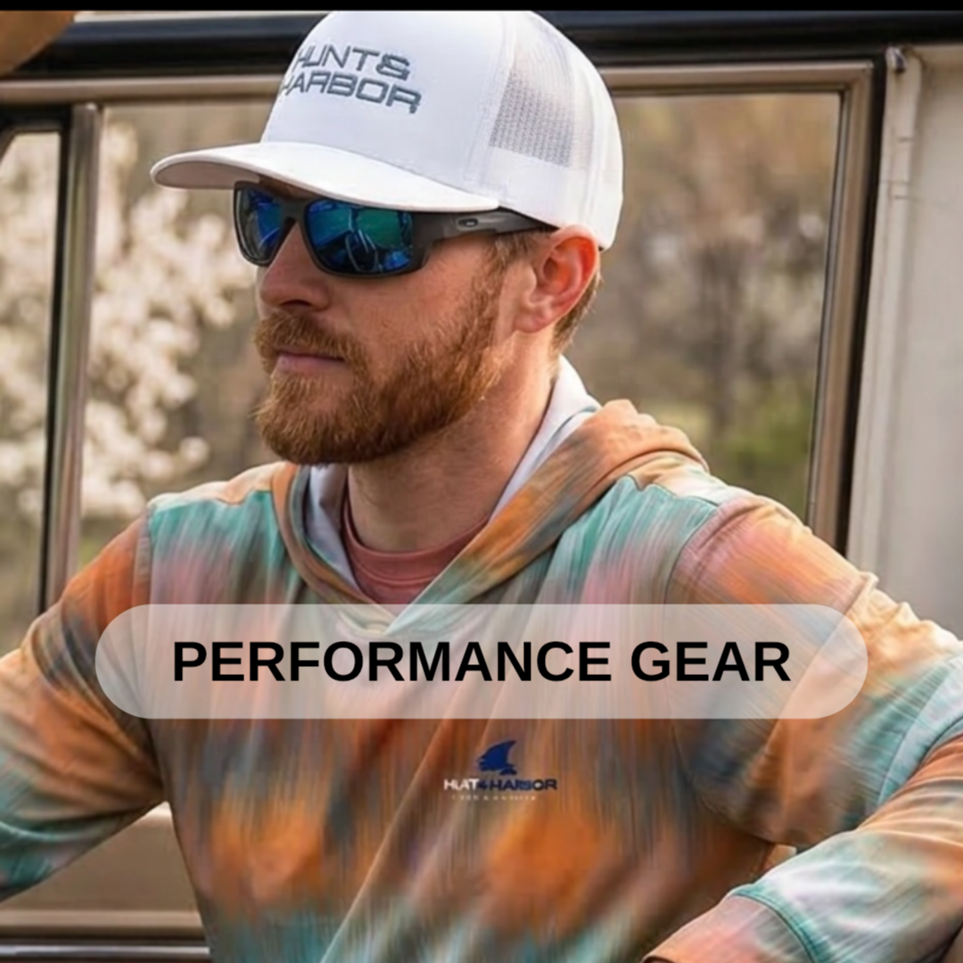 A man with a beard wearing sunglasses, a white cap with text, and a colorful tie-dye hoodie, standing outdoors near glass windows, with the words 'Performance Gear' and a logo on the image.