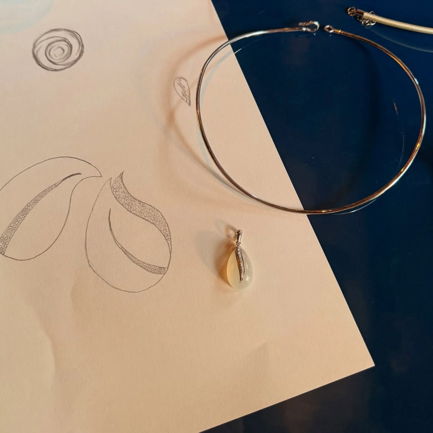 Sketched by hand. Carved by hand. A single moonstone that glows only in motion.
Dropping this weekend.