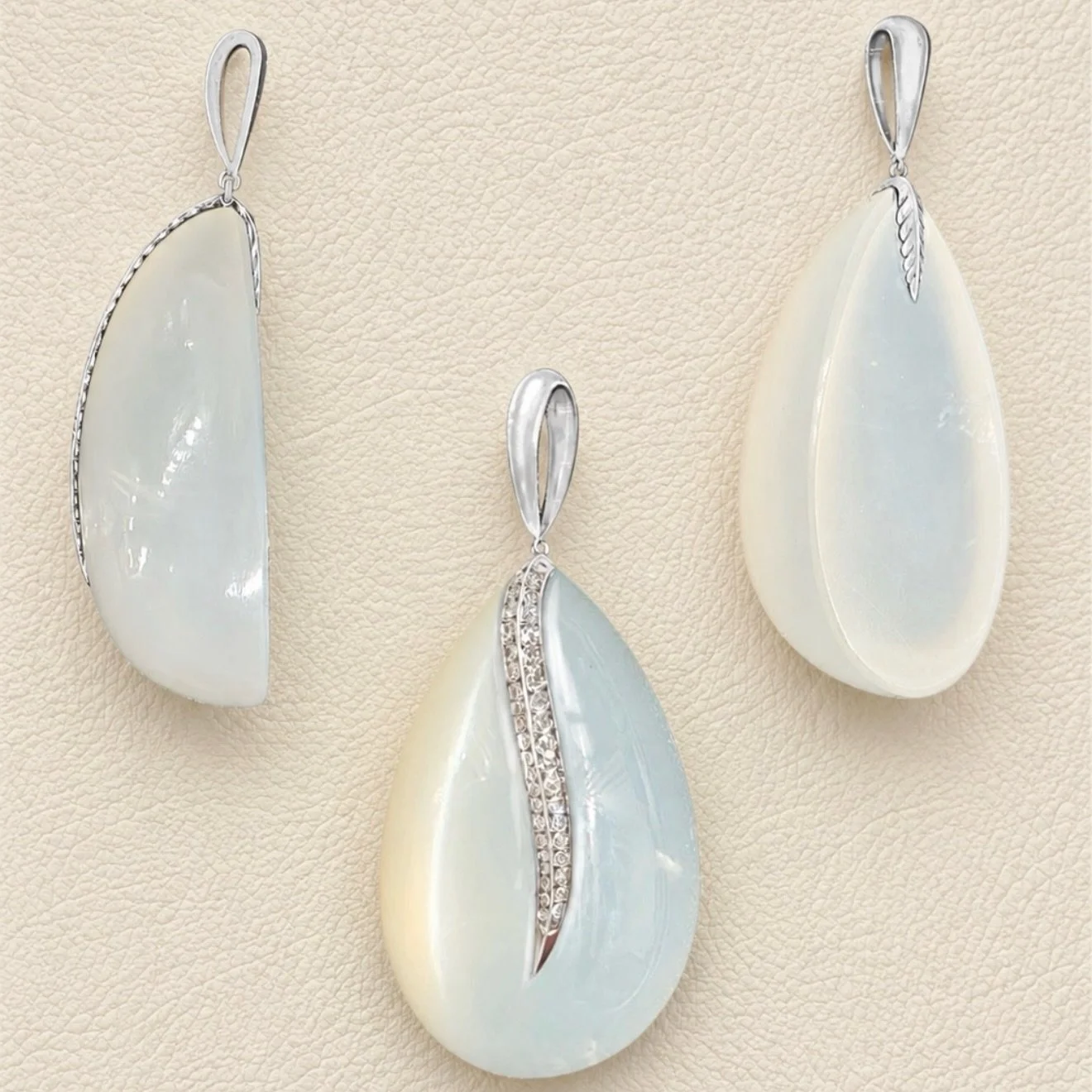Sketched by hand. Carved by hand. Diamonds set into the moonstone.
Down to the last detail.