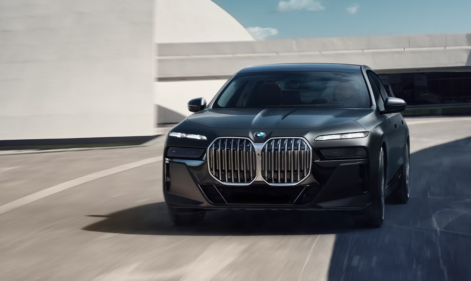 Black BMW 7 Series in motion for MP Limousine First Class executive chauffeur service in Dallas–Fort Worth