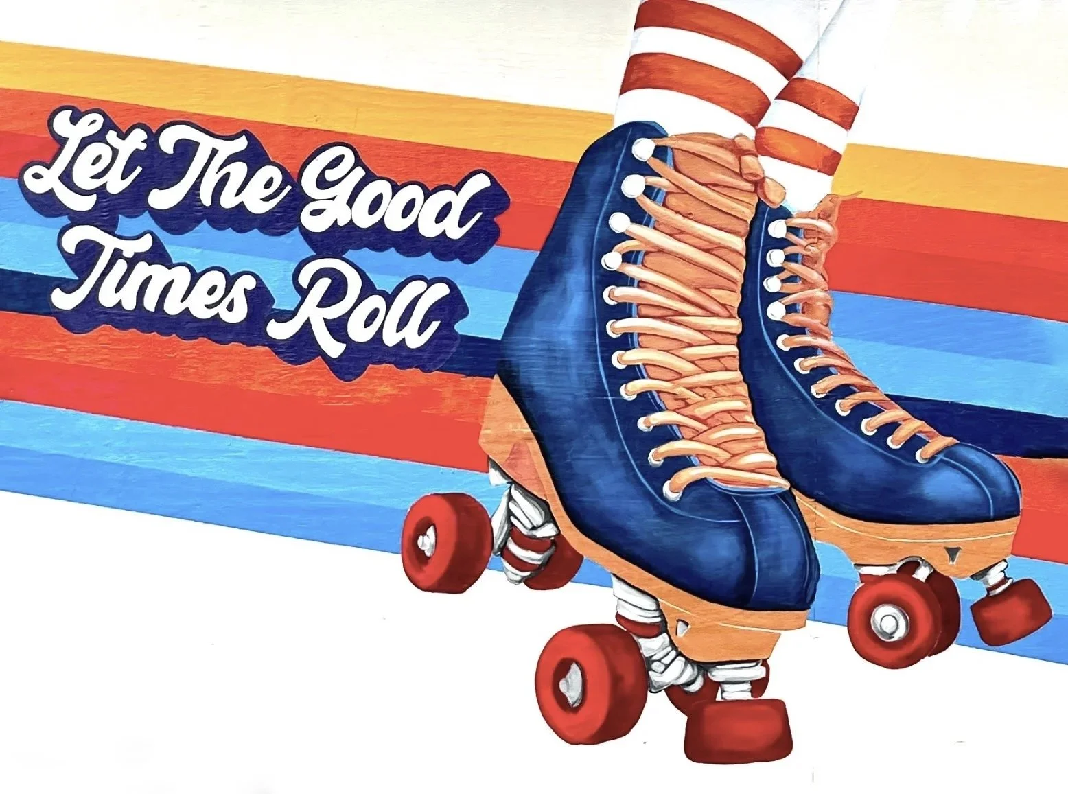 Painting of a pair of roller skates with blue boots, orange laces and wheels, set against a retro background with red, orange, blue, and white stripes. Text reads, 'Let The Good Times Roll'.