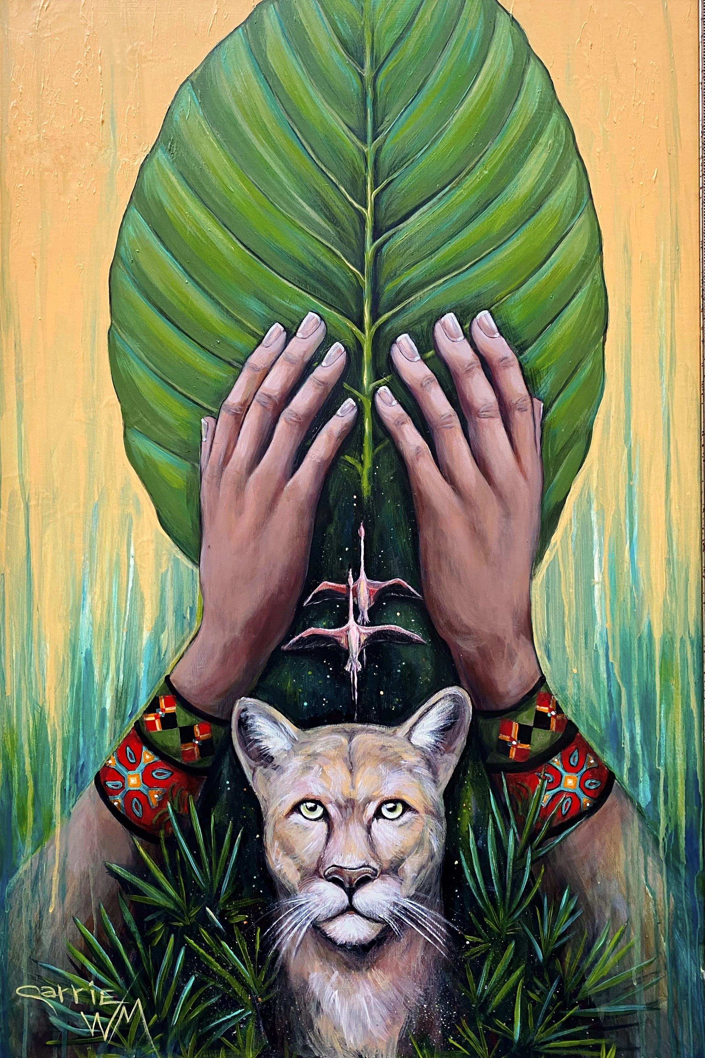 A vibrant painting featuring two human hands holding a large green tropical leaf, with a lion's face at the bottom, surrounded by green plants. The background is a textured mix of yellow and green hues.
