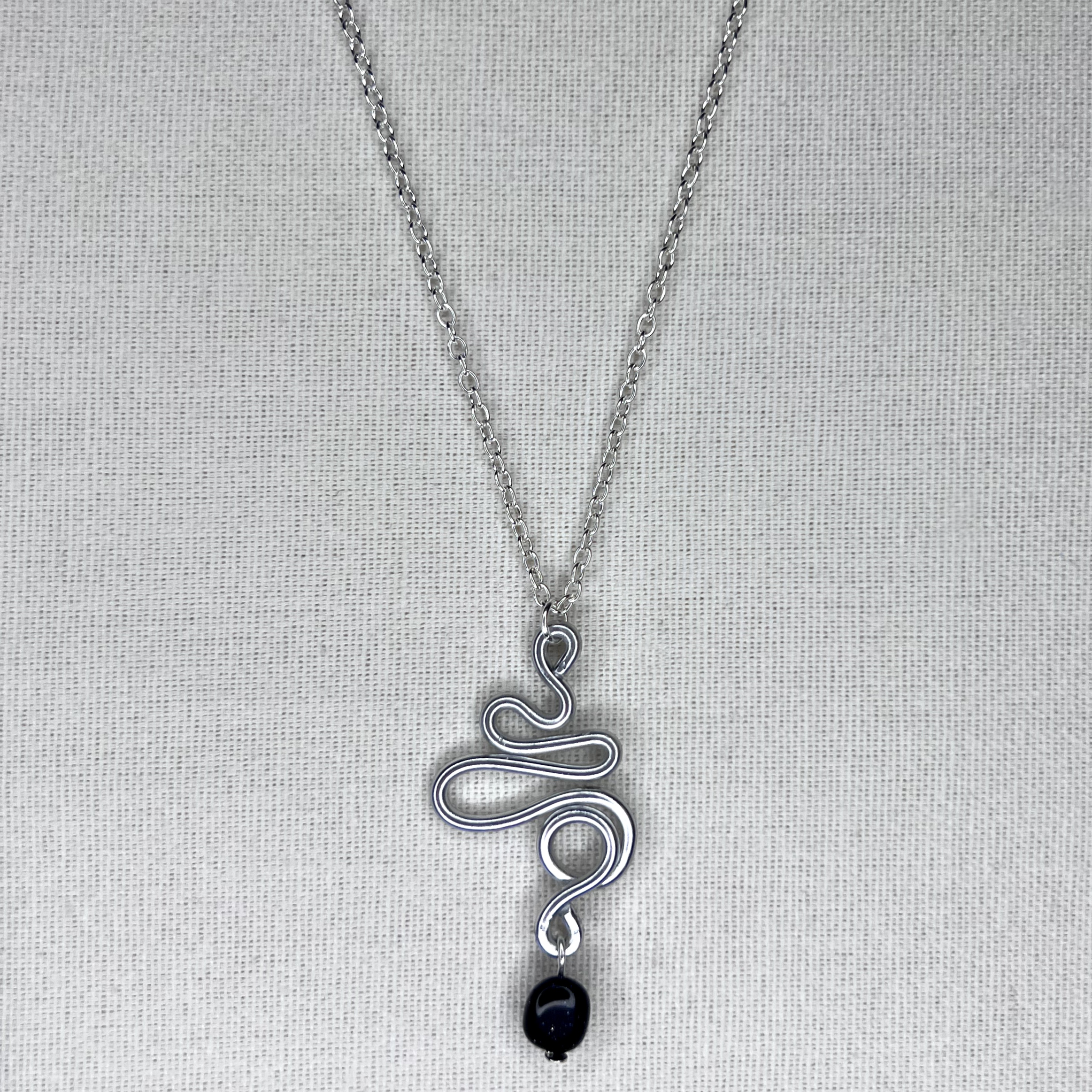 The Ribbon Nexus Pendant