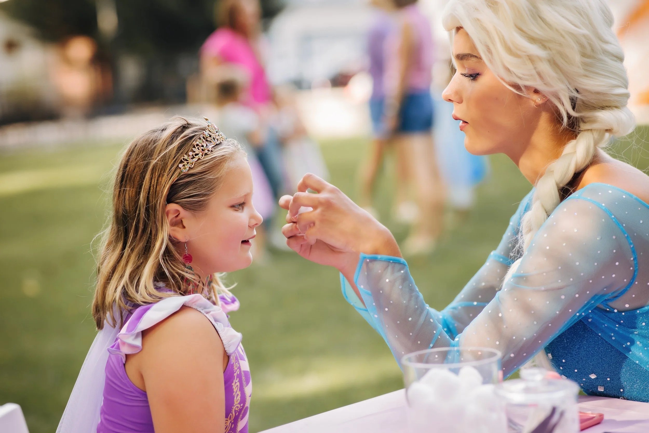princess applying makeup at princess party