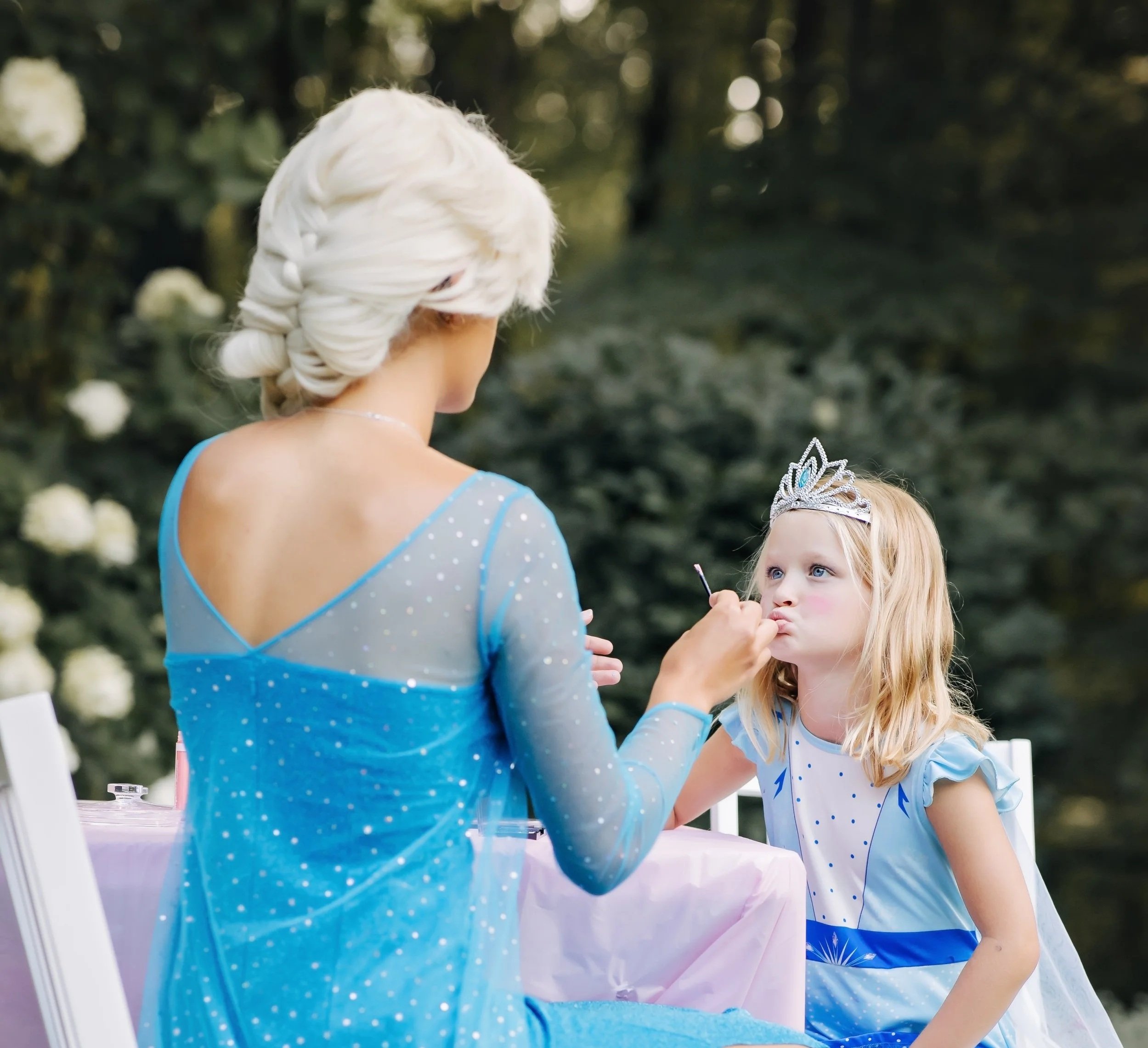 Princess applying makeup at 5 year old birthday party