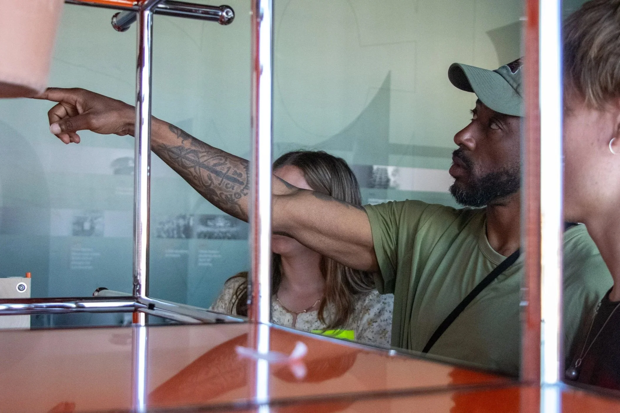 Discussion between Kevin Jones and Adler Dills over the placement of student work